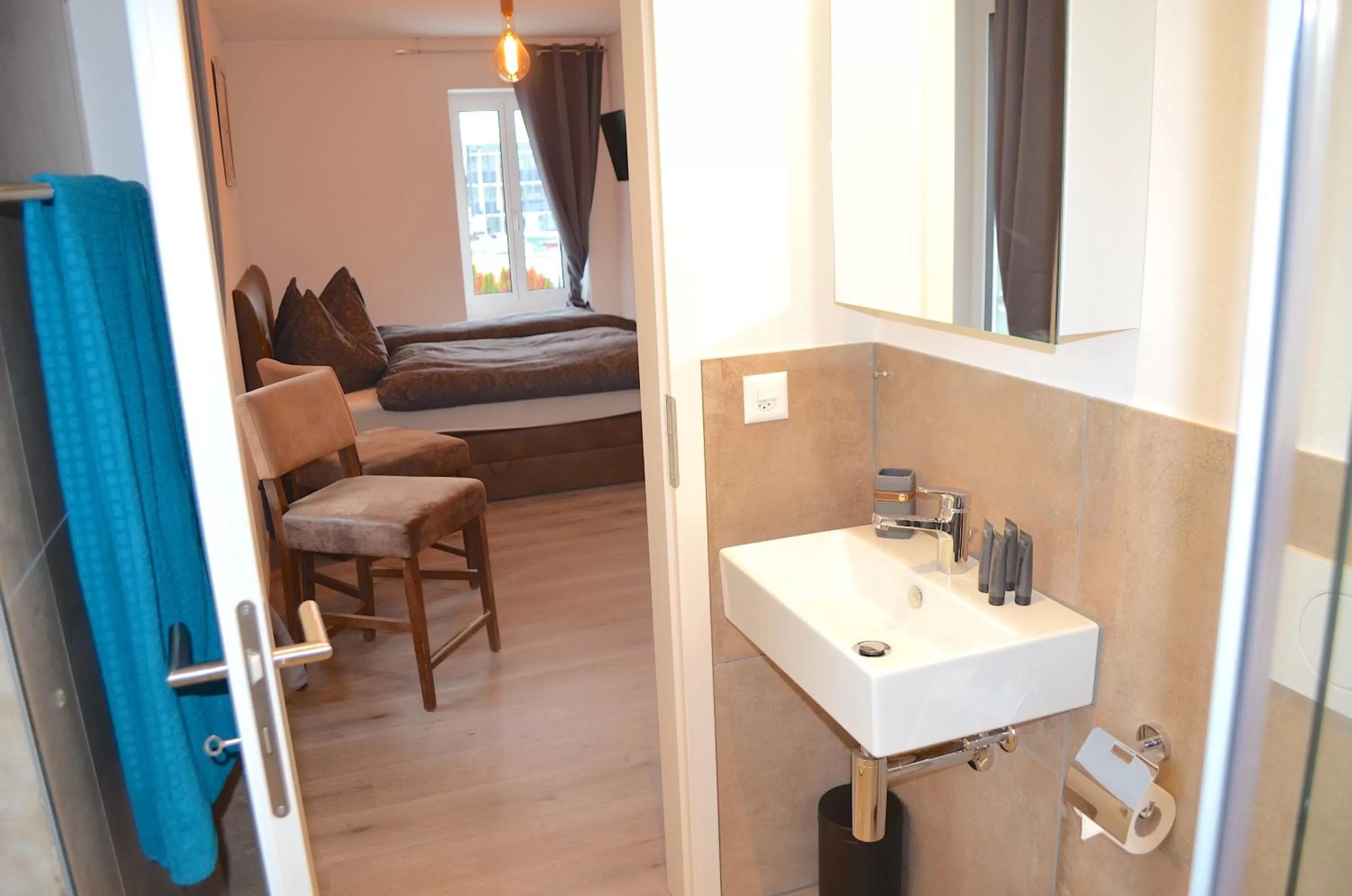 Bathroom, Bed in Guesthouse Meitschi Thun - contactless self check-in