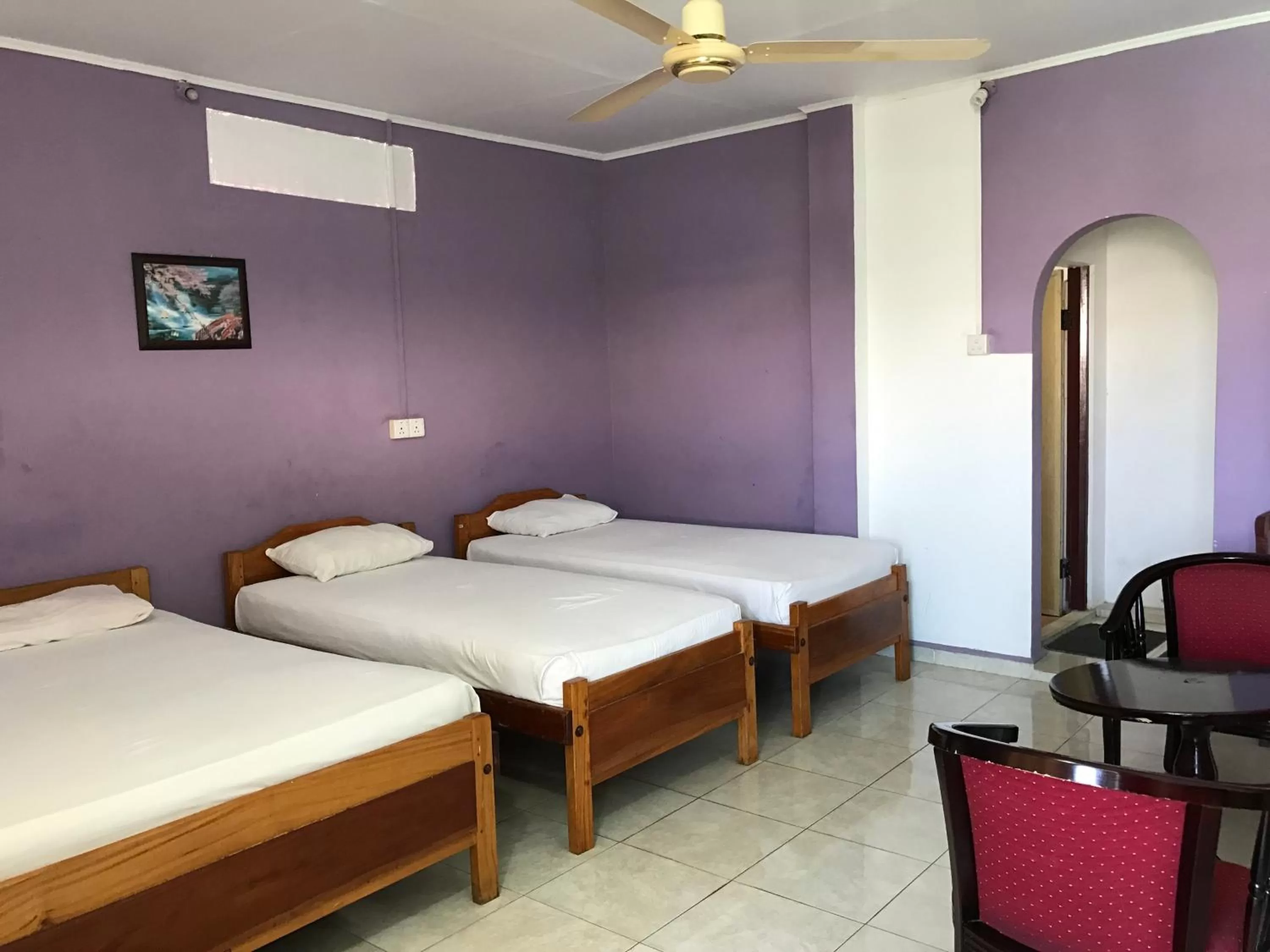 Bed in Gnaanams Hotel and Restaurant