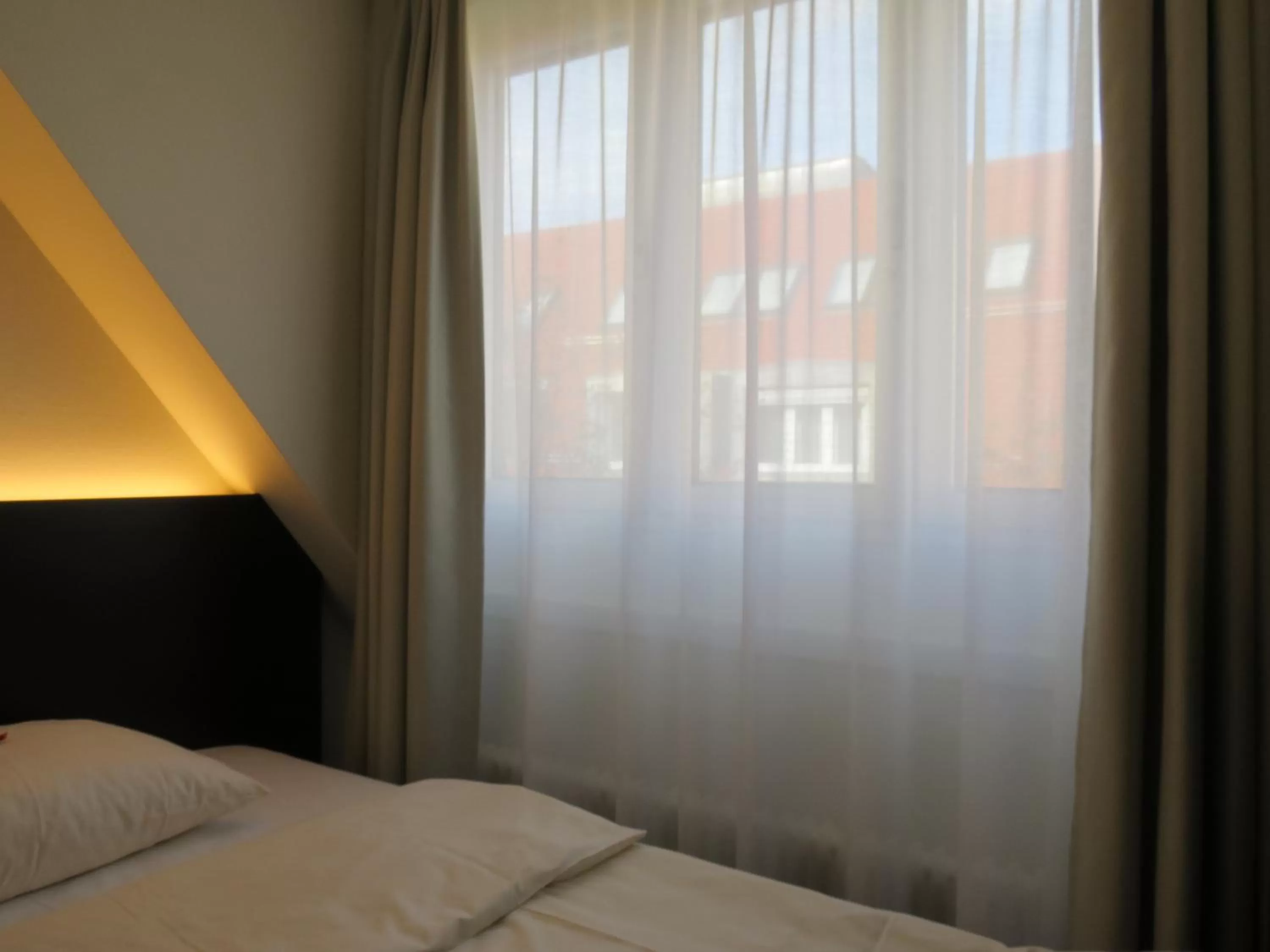 Bed in Comfor Hotel Ulm City