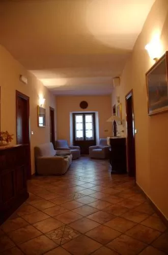 Seating area, Bed in Albergo Miramonti