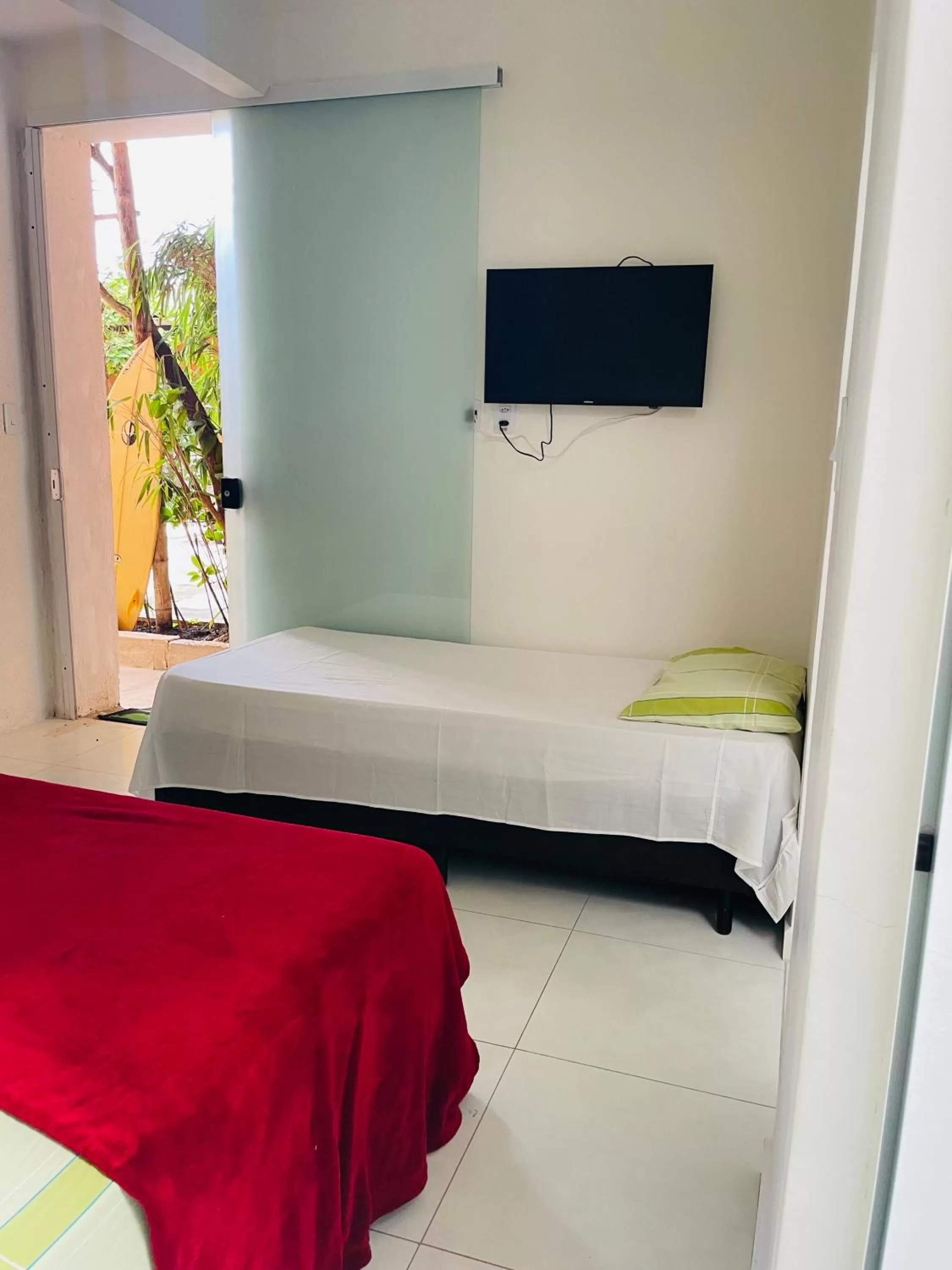 Bed in Pousada Praia do Tombo