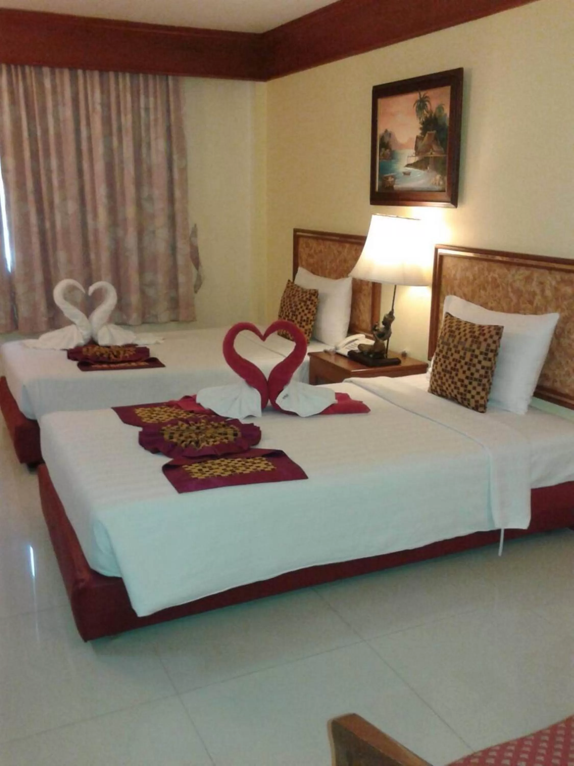 Bed in The Camelot Hotel Pattaya