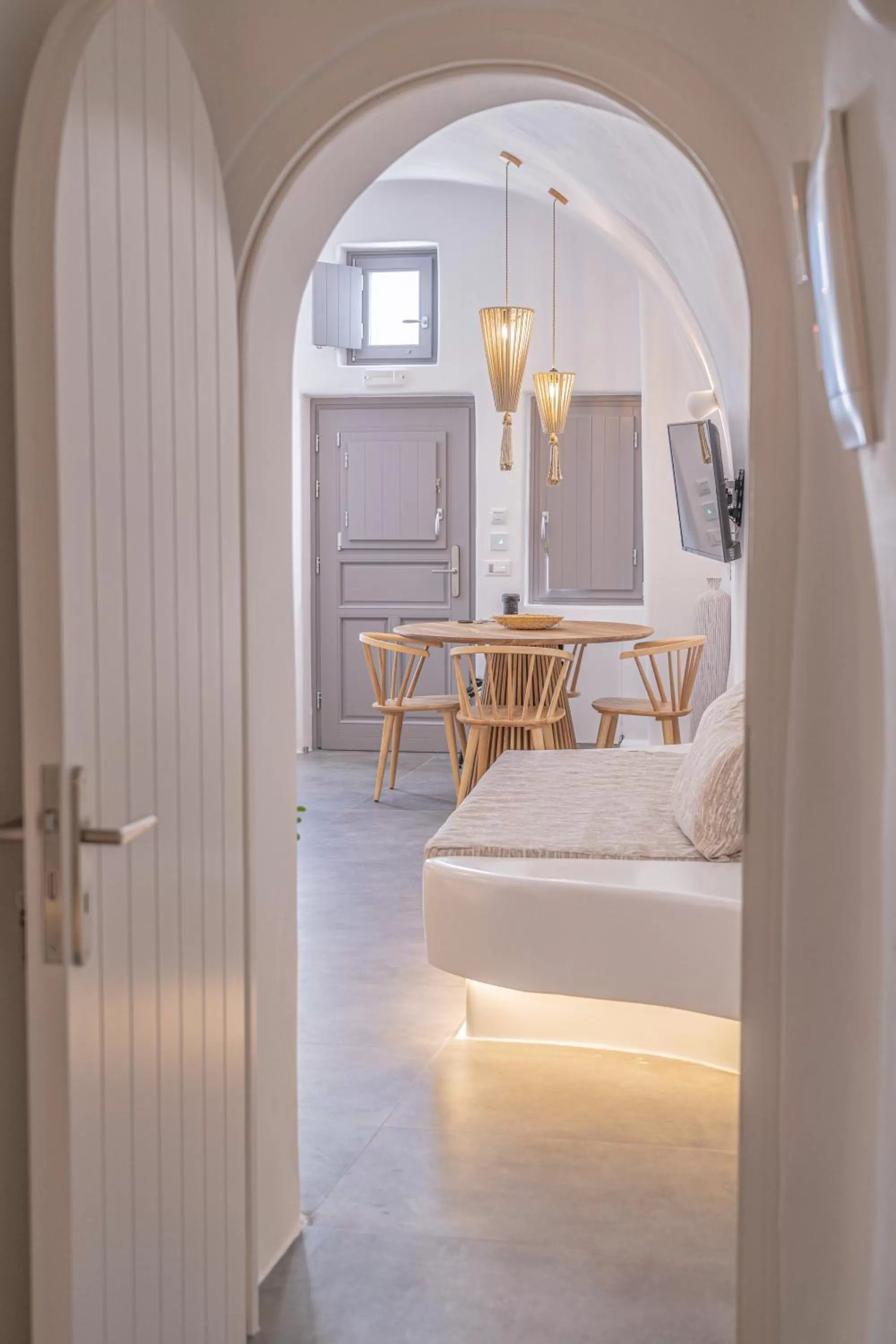 Living room, Bed in Eternity Suites Santorini