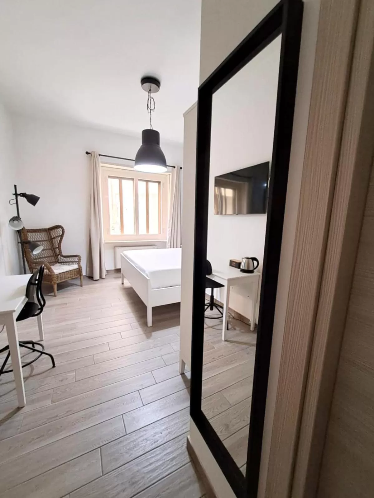 Bed in Ajana Rooms by Accomodo