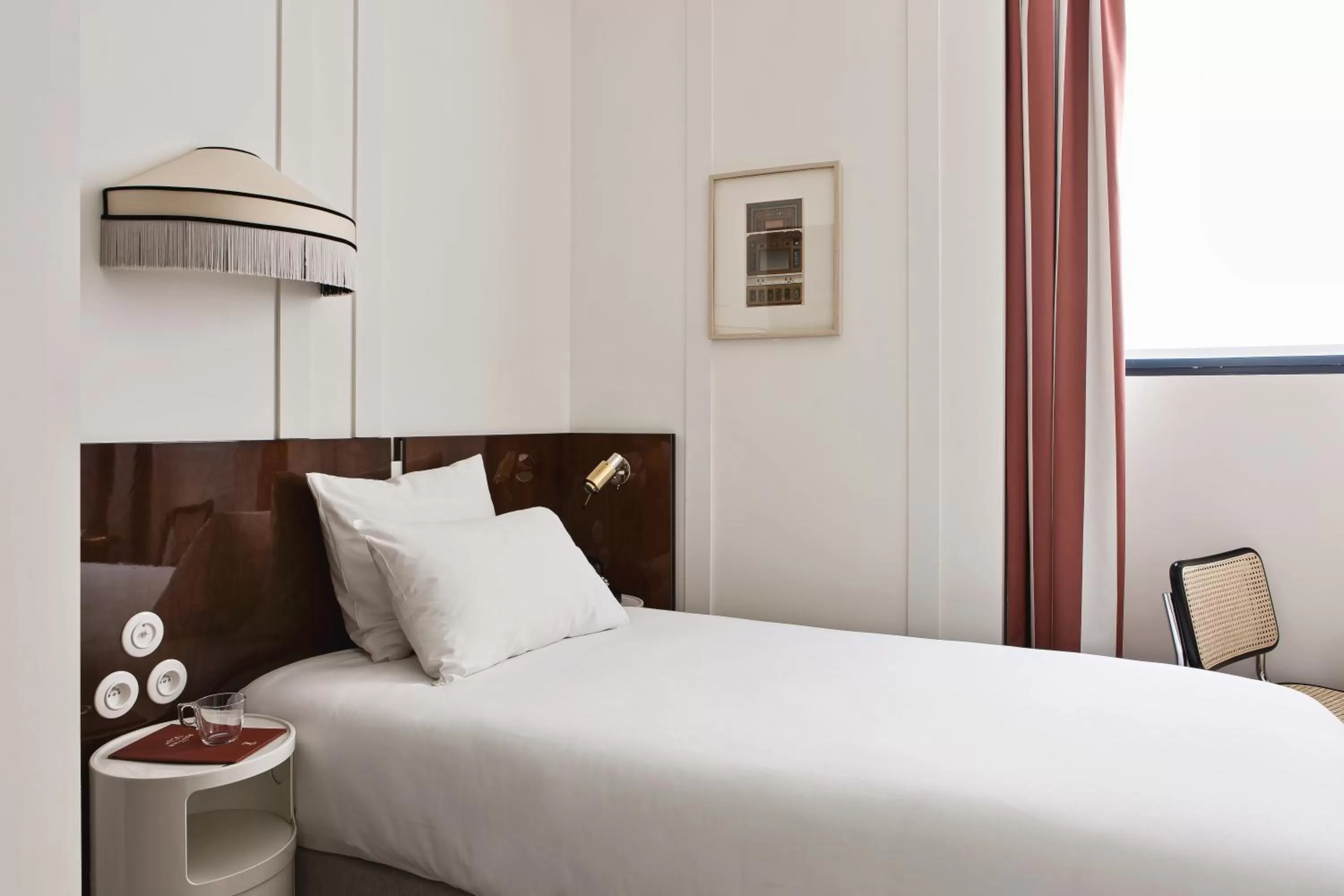 Property building, Bed in Hôtel Wallace, a Member of Design Hotels