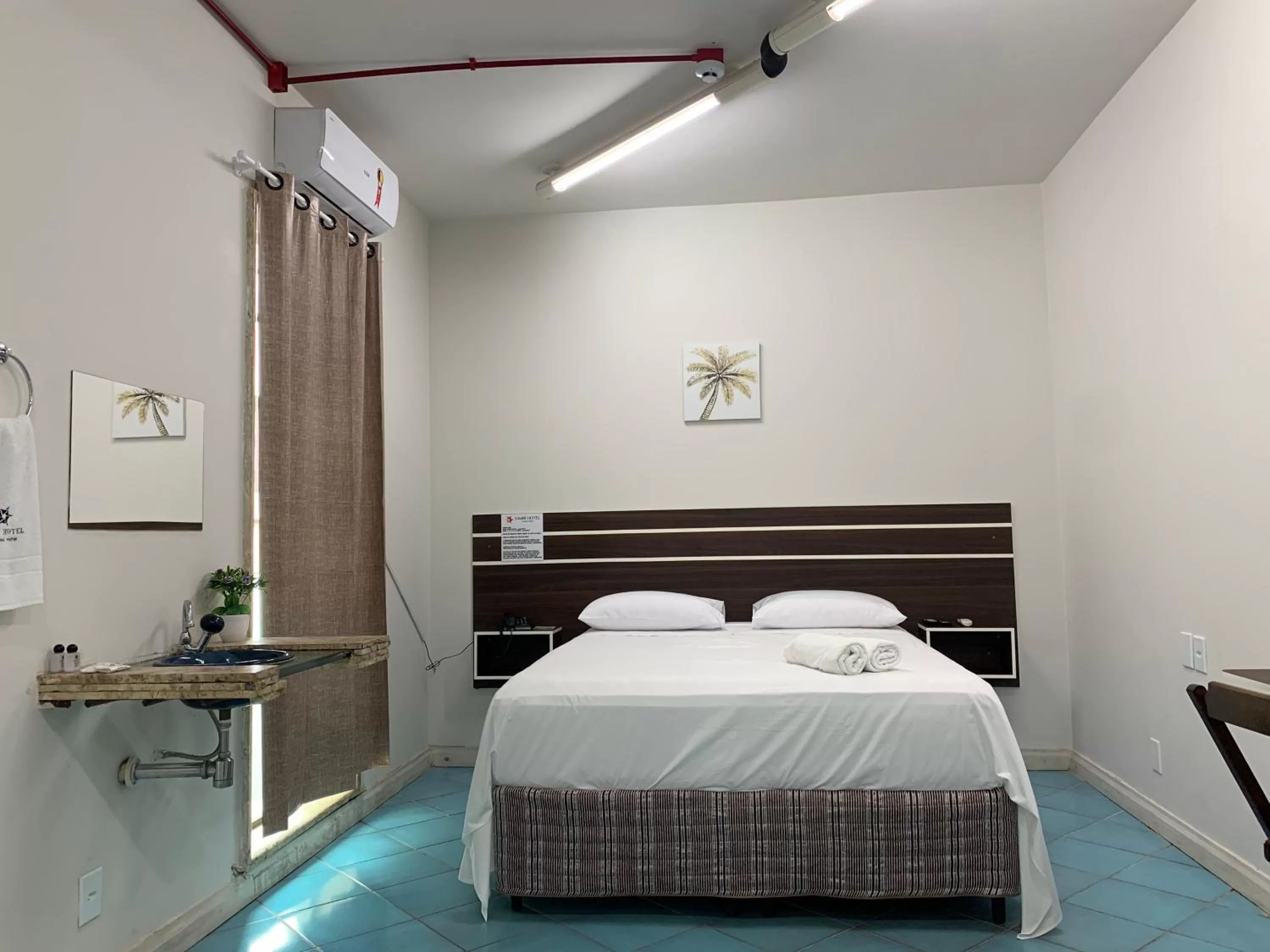 Bed in SAMIR HOTEL COMFORT