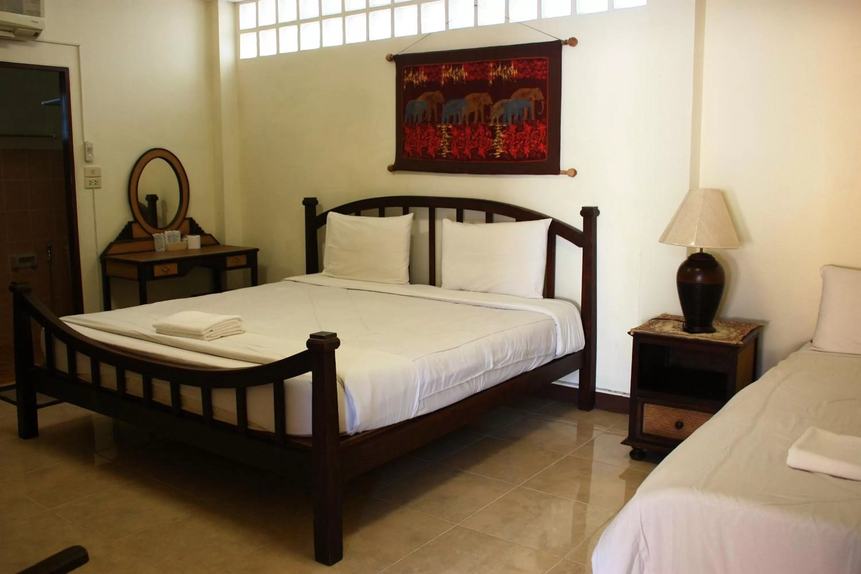 Bed in โรงแรมตีฆ้อง - Tri Gong Hotel