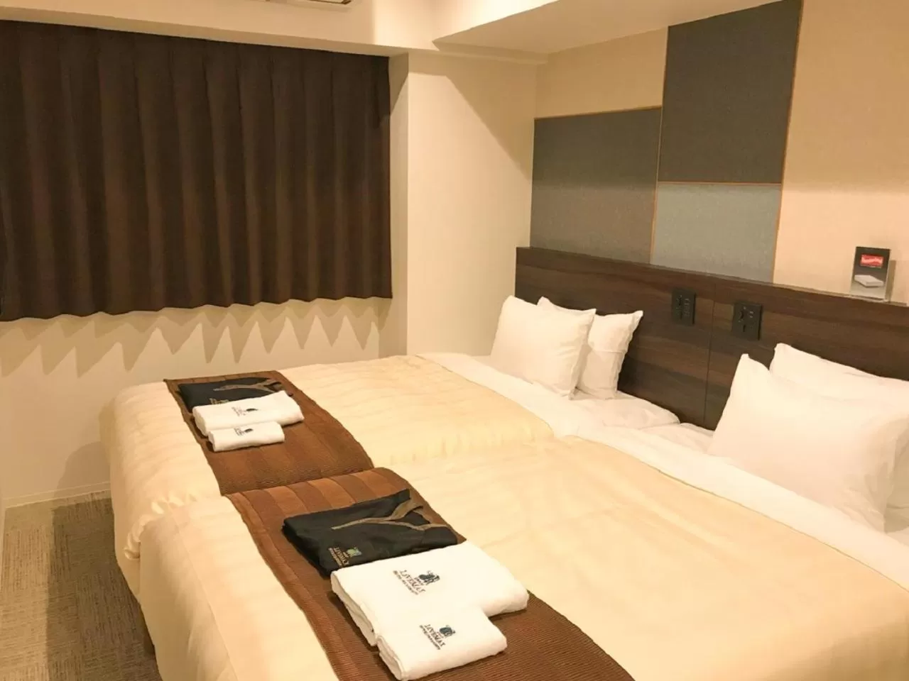 Bed in HOTEL LiVEMAX PREMIUM Sapporo Odorikoen