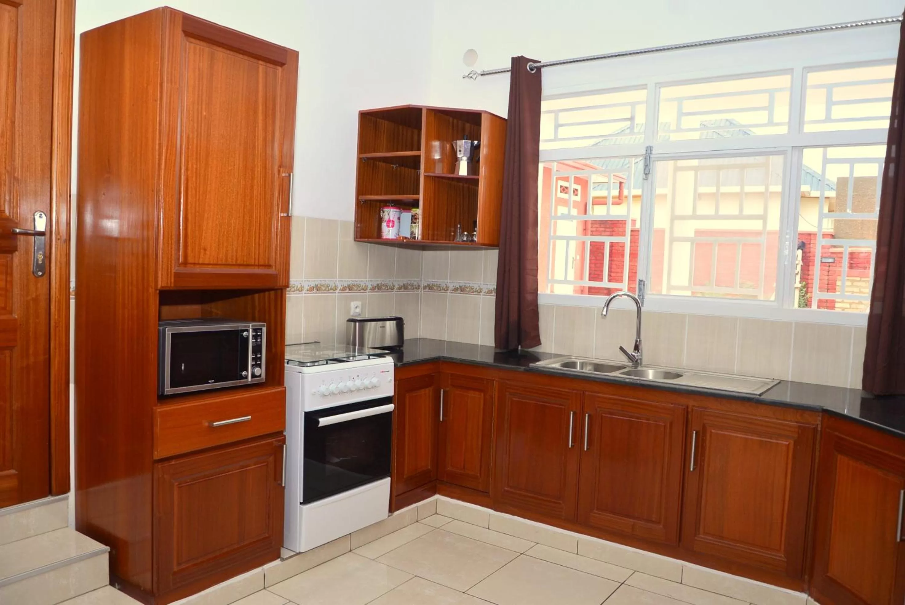 Kitchen or kitchenette in Hôtel Maisons-Sifa