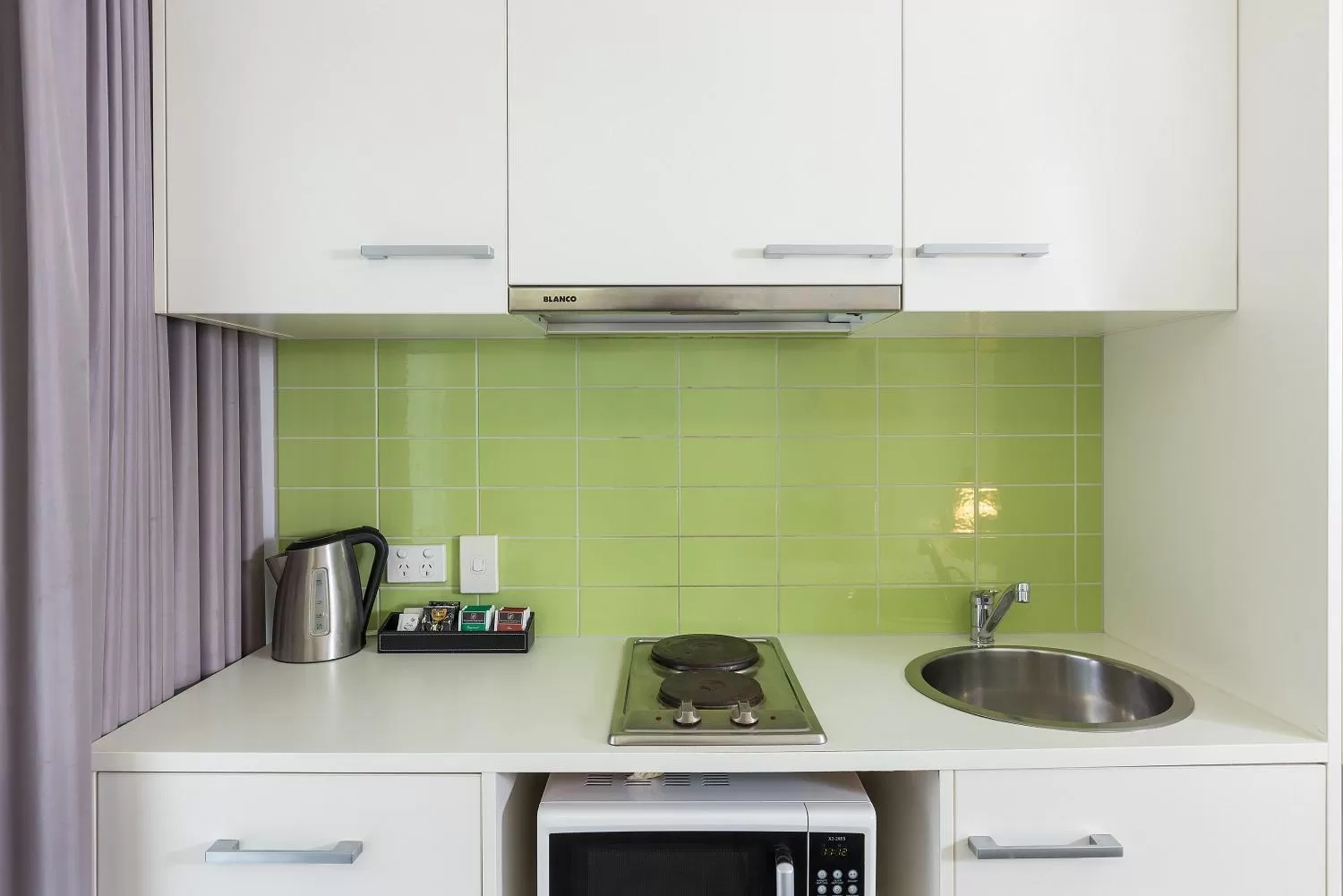 Kitchen or kitchenette in City Edge North Melbourne Apartment Hotel