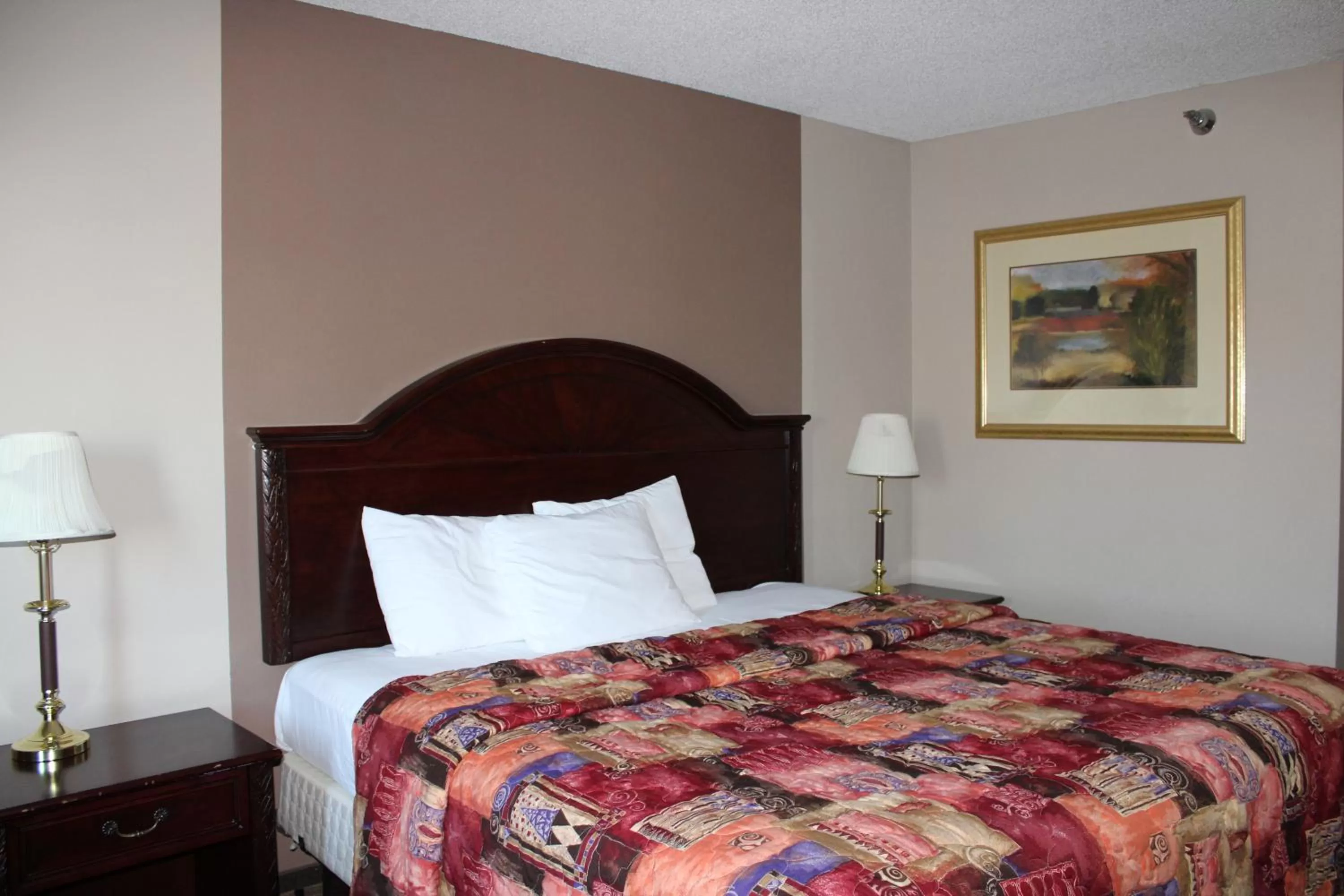 Bedroom, Bed in Coratel Inn and Suites Maple Grove