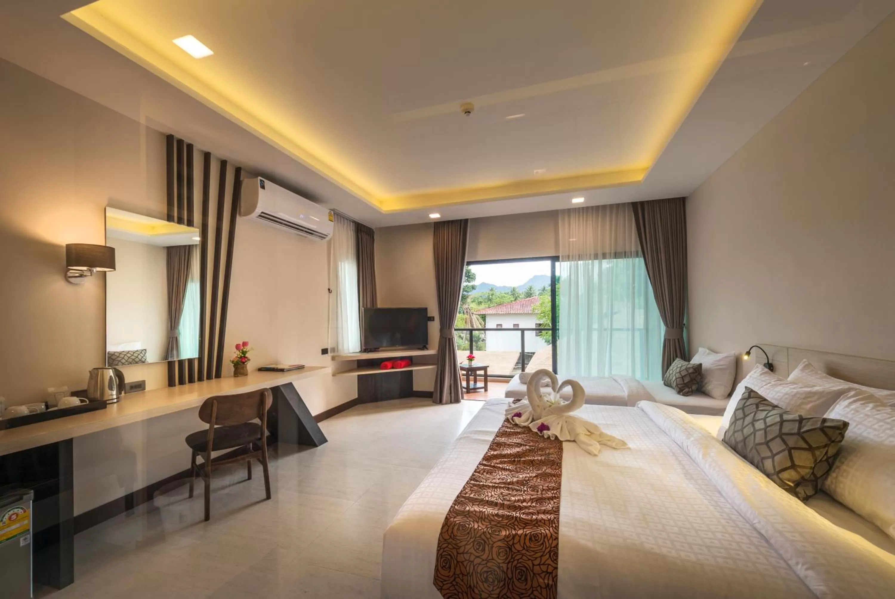 Bed in Cher​mantra​ Aonang​ Resort & Pool​ Suite
