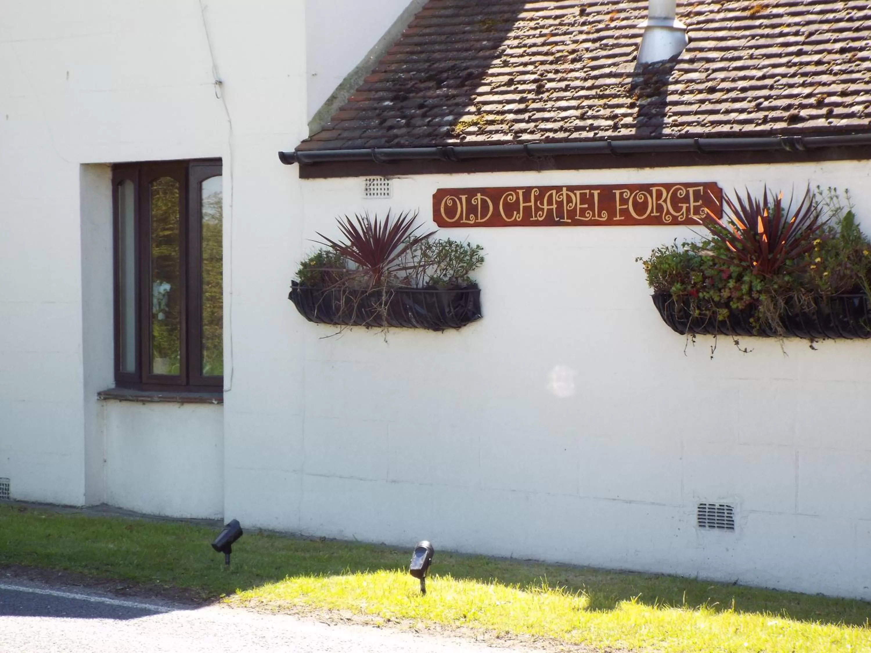 Property logo or sign in Old Chapel Forge