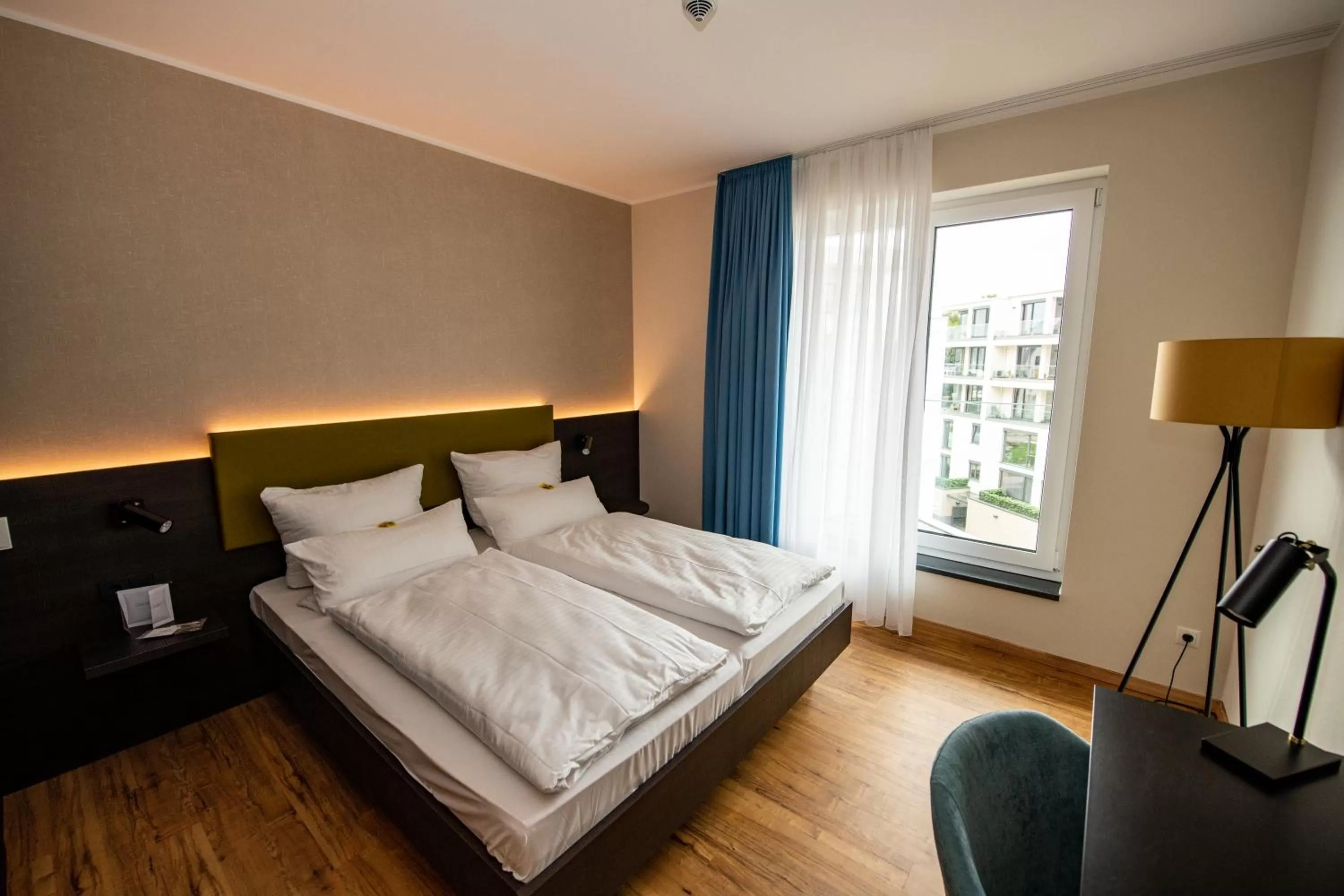 Photo of the whole room, Bed in EINSTEIN Hotel am Römerpark