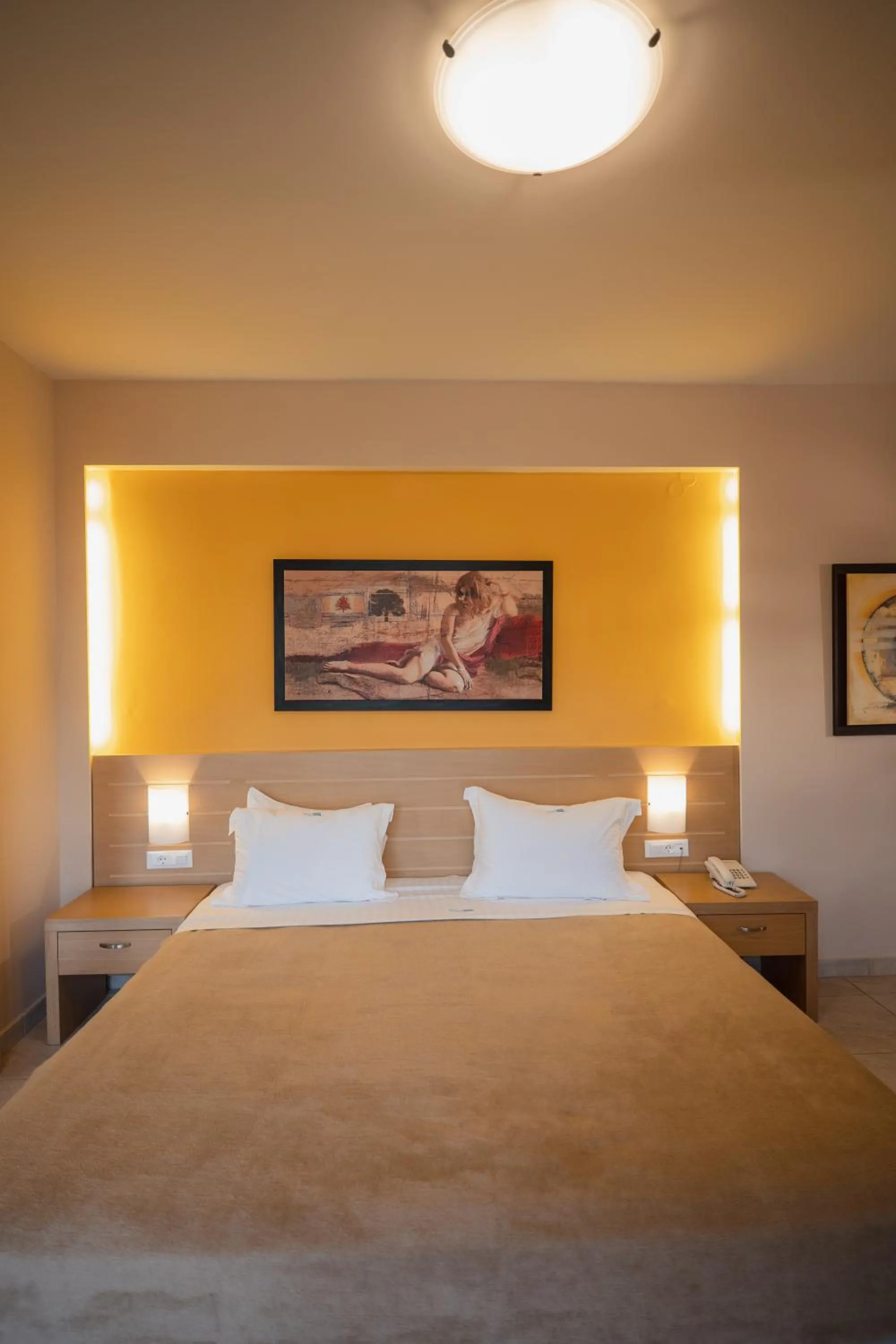 Bed in Molos Bay Hotel