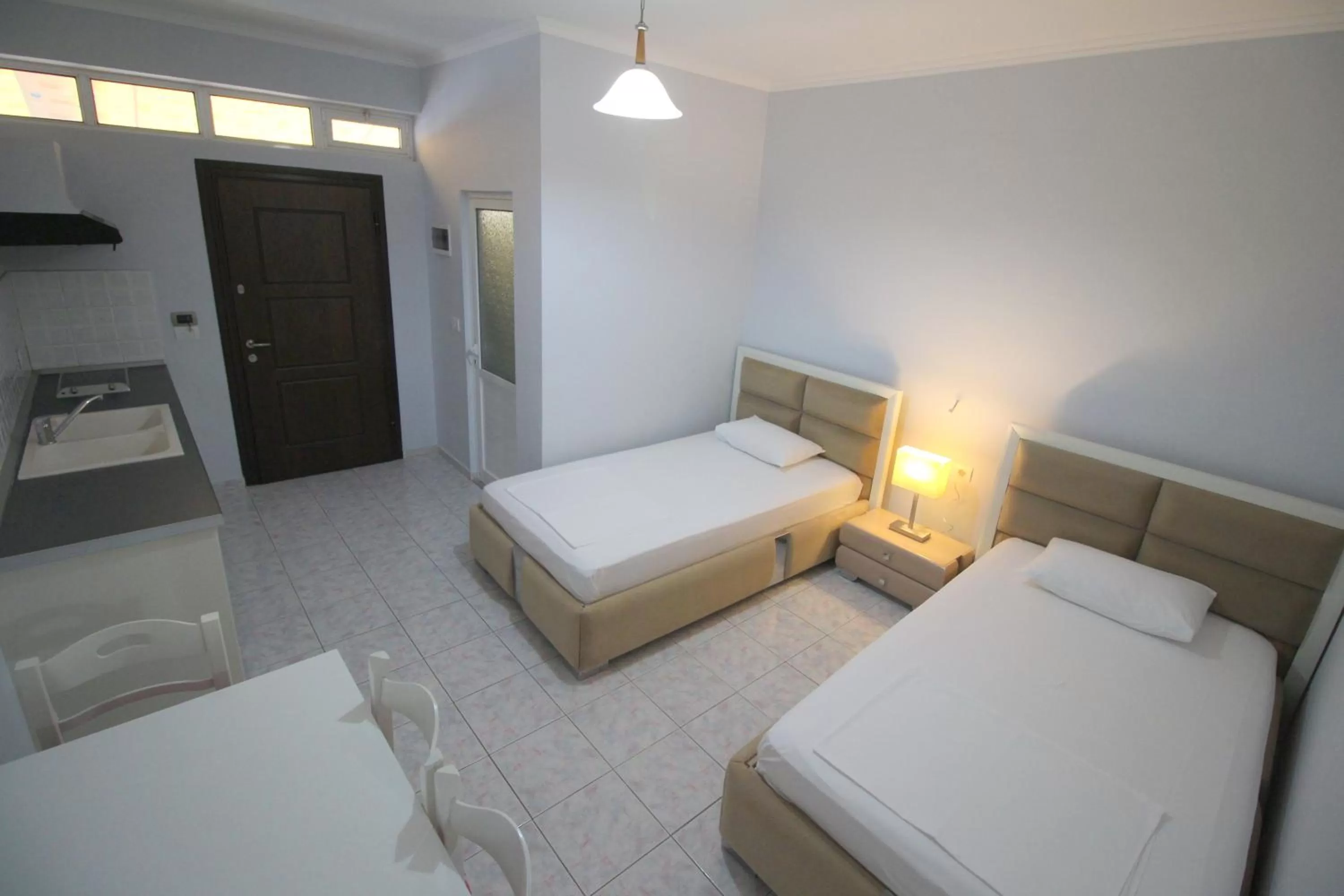 Bed in Murati Suites Sarandë