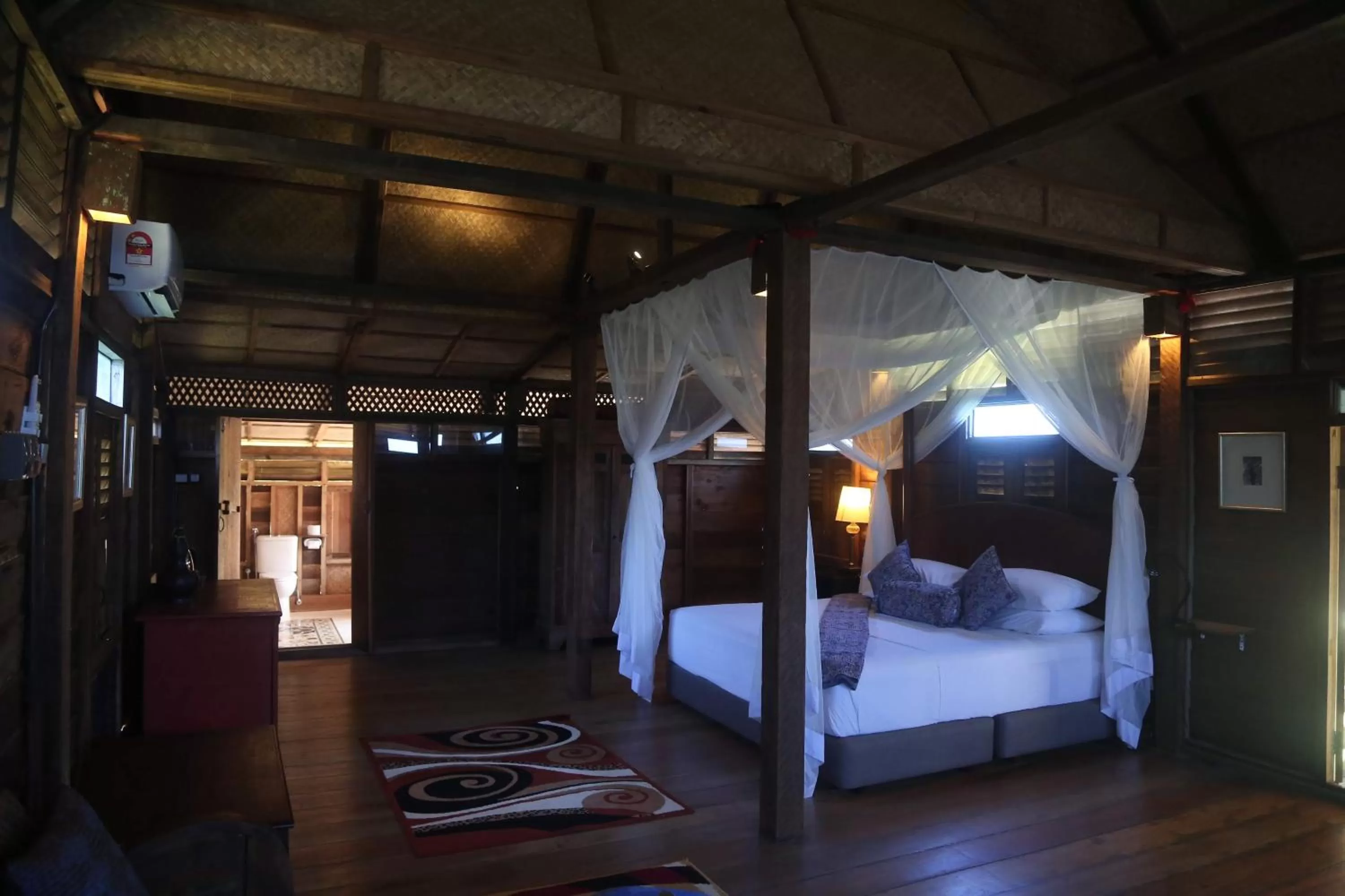 Bed in Kunang Kunang Heritage Villas