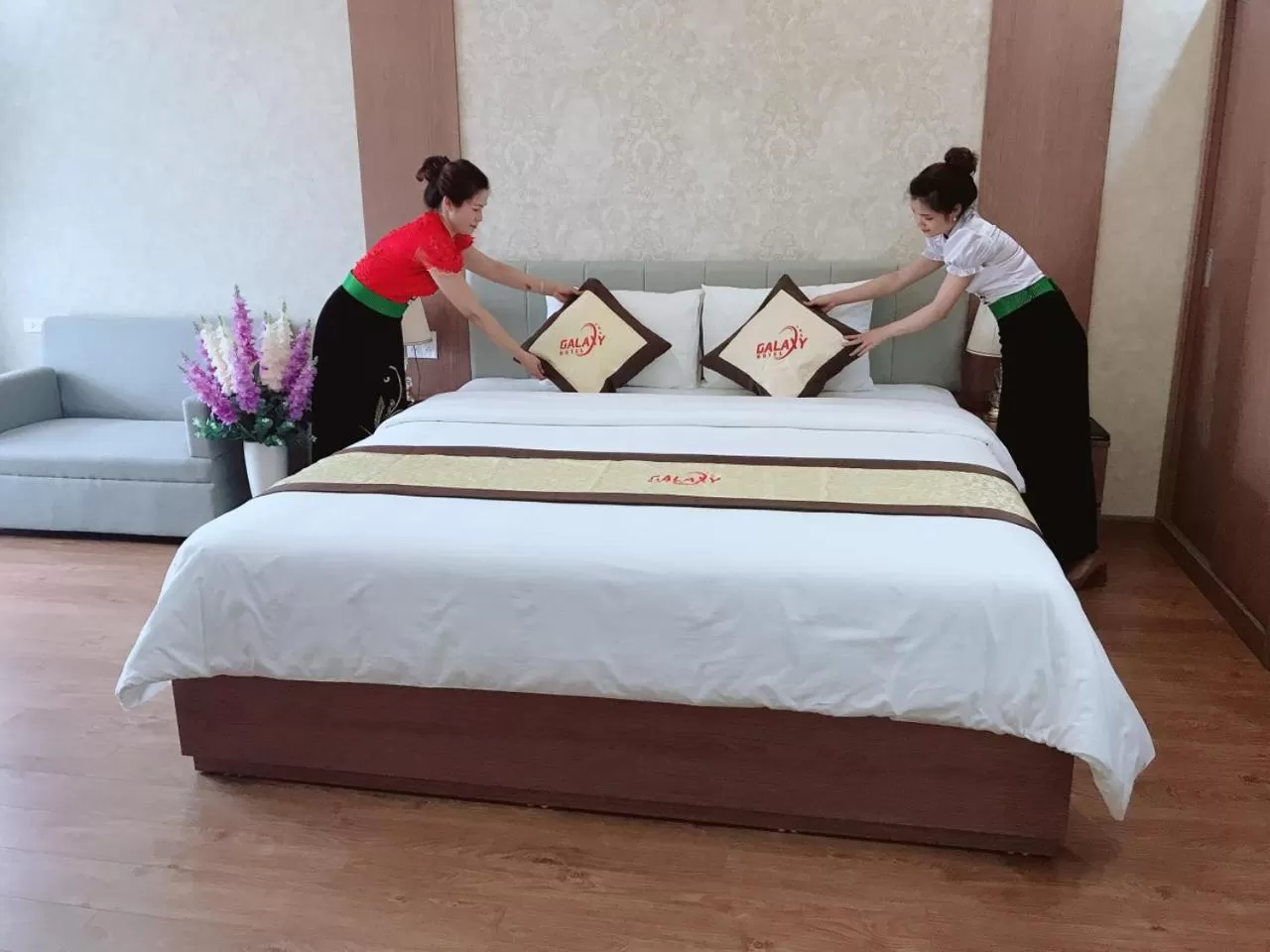 Bed in Galaxy Grand Hotel