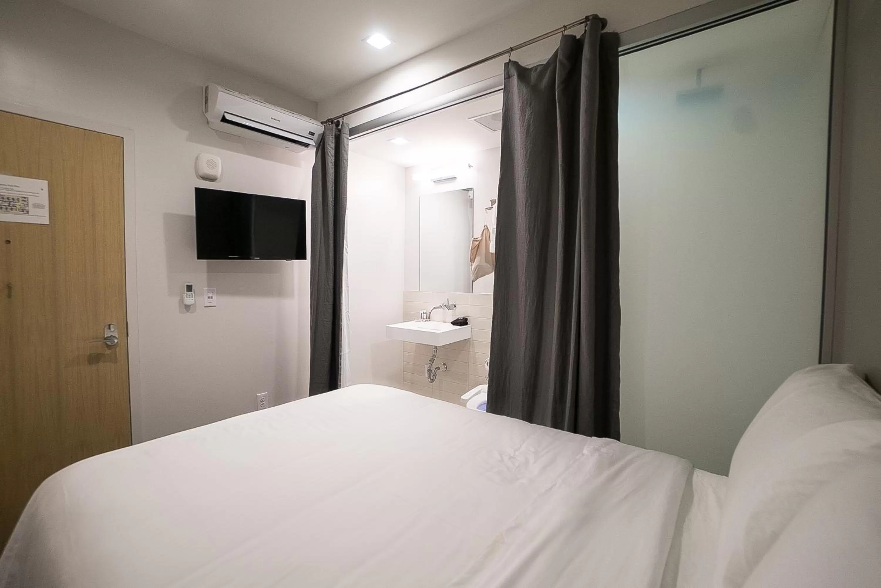 Bed in SOVA Micro-Room & Social Hotel