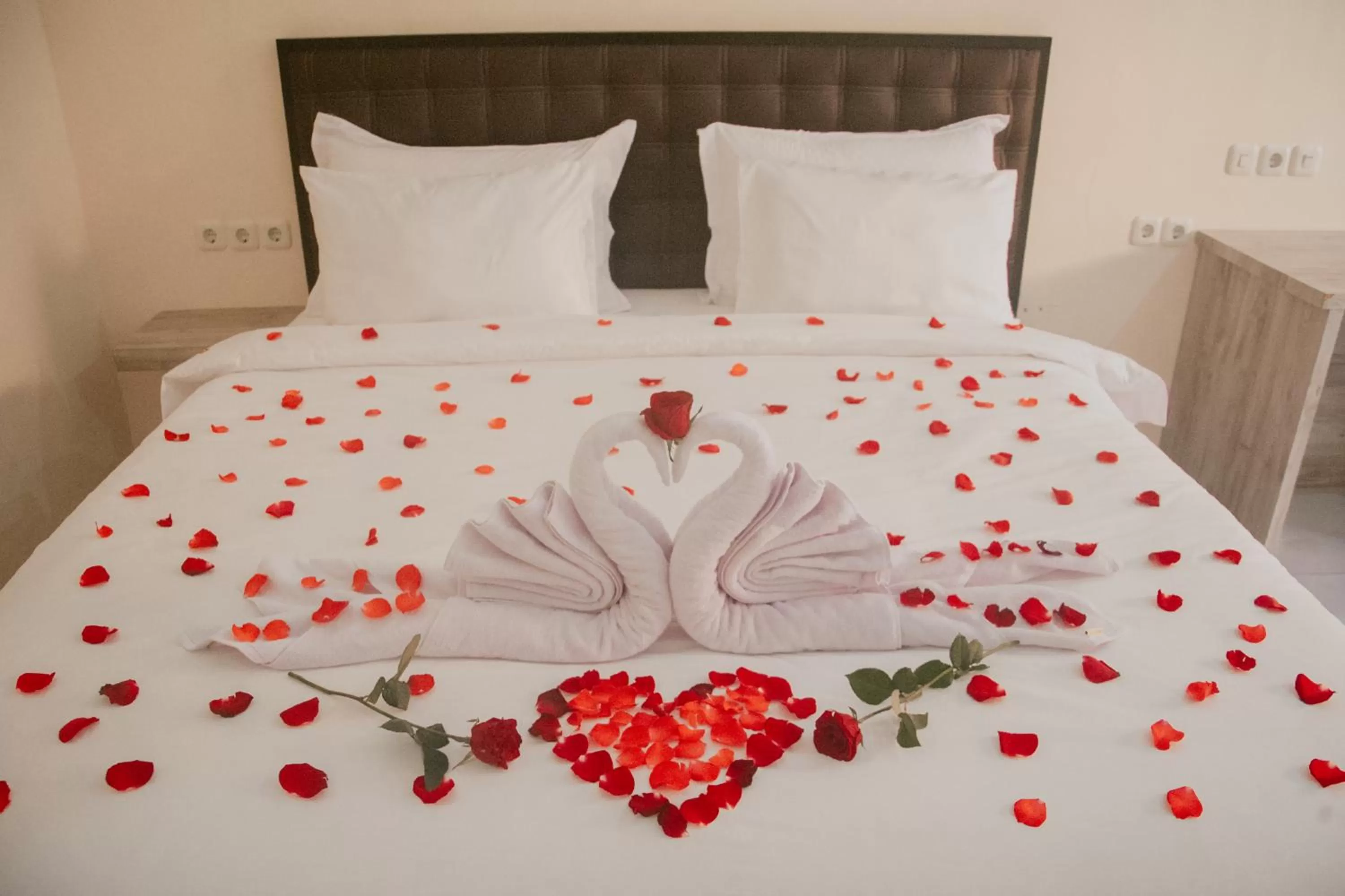 Bed in THE LAVIANA HOTEL