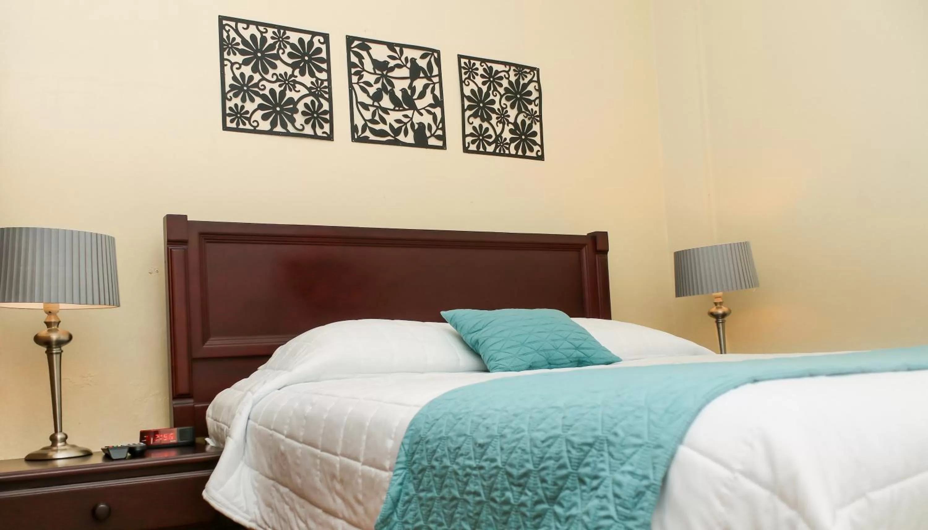 Bed in Las Magnolias Hotel Boutique