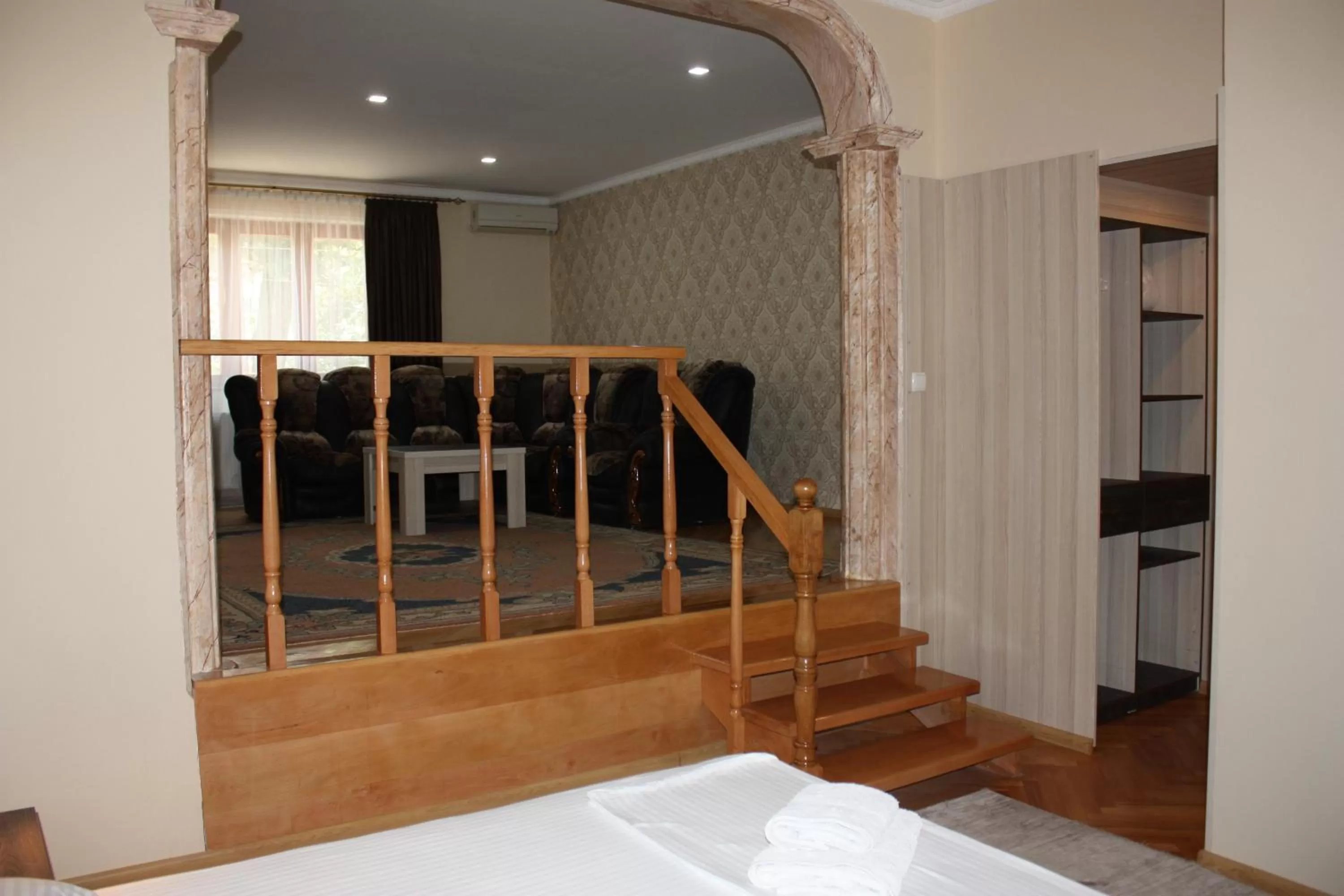 Living room, Bed in Paradise Hotel