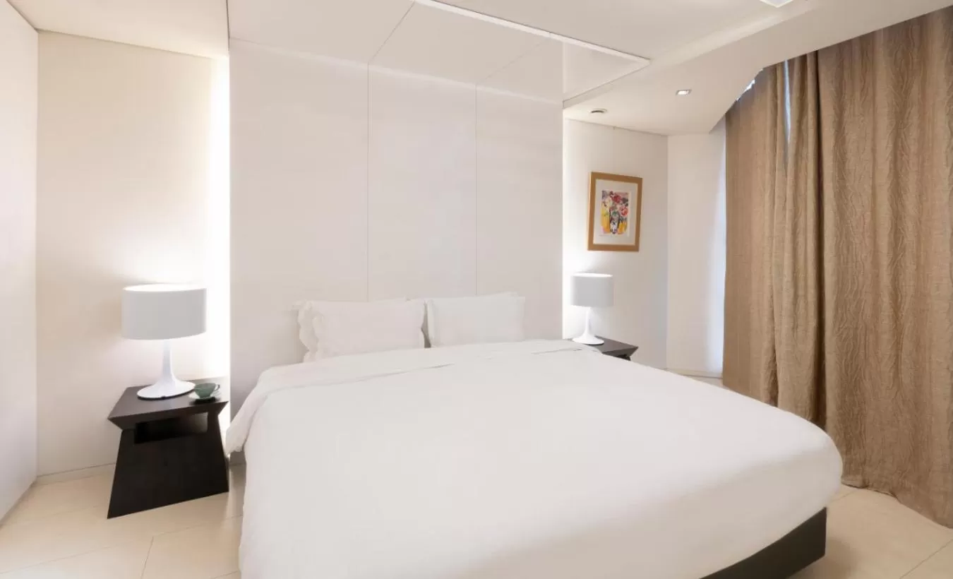 Bed in The Classic 500 Pentaz Executive Residence