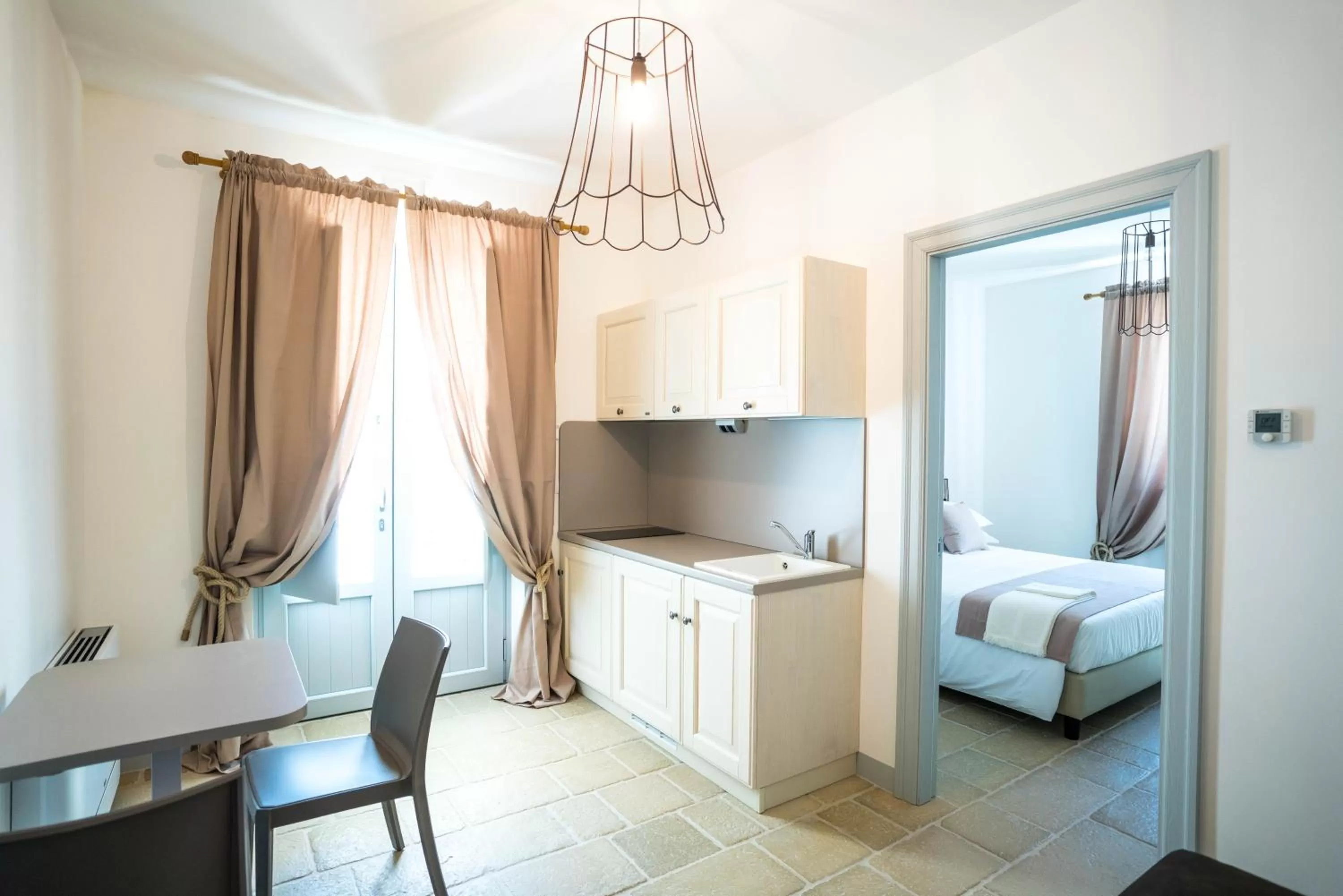Kitchen or kitchenette, Bed in Borgo Cozzana