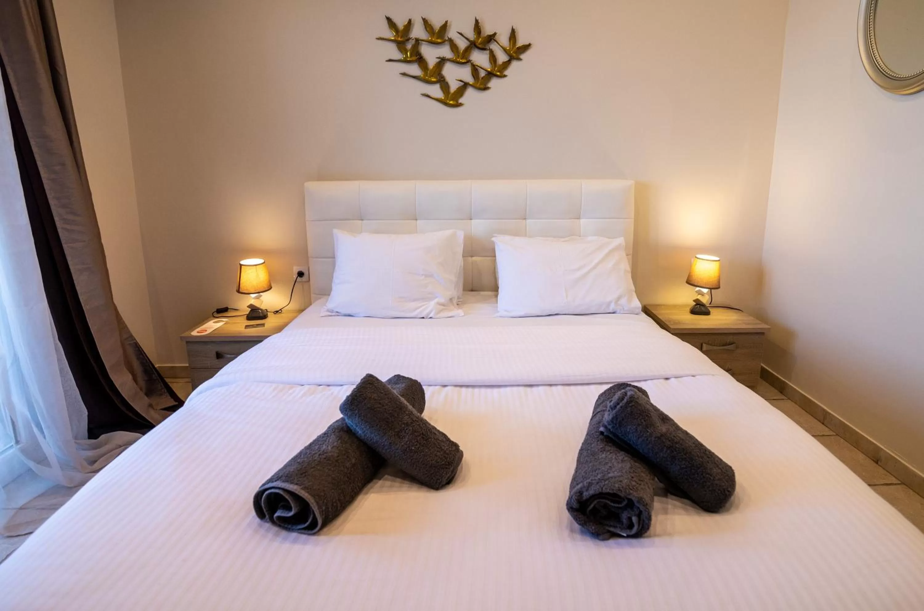 Bed in Votsalakia Hotel & Luxury Apartments