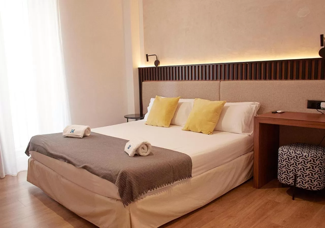 Bed in ISA Sevilla Suites