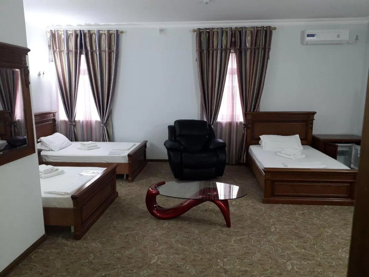 Bed in Maximum Hotel