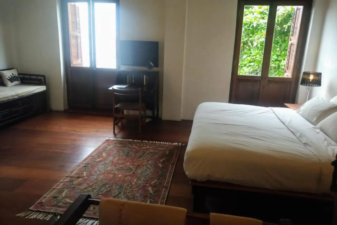 Bed in Ren I Tang Heritage Inn