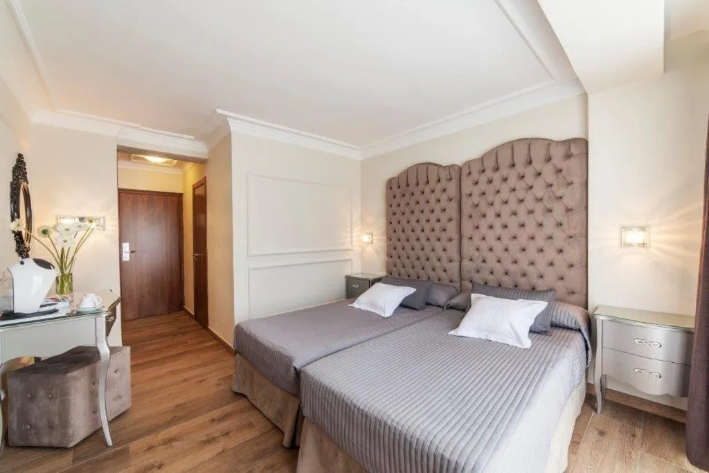 Bed in Essence Hotel Boutique