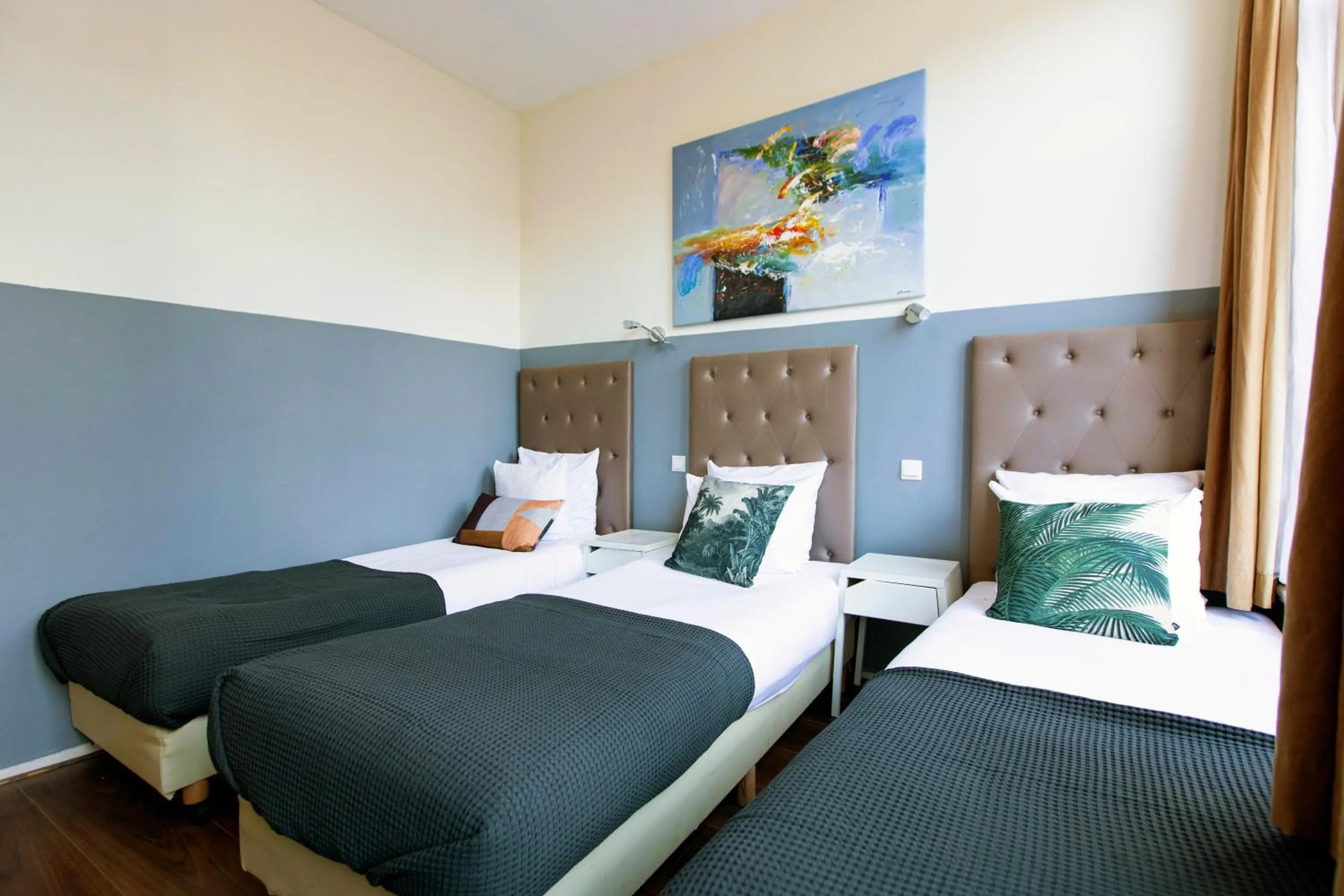 Bed in Quentin Arrive Hotel