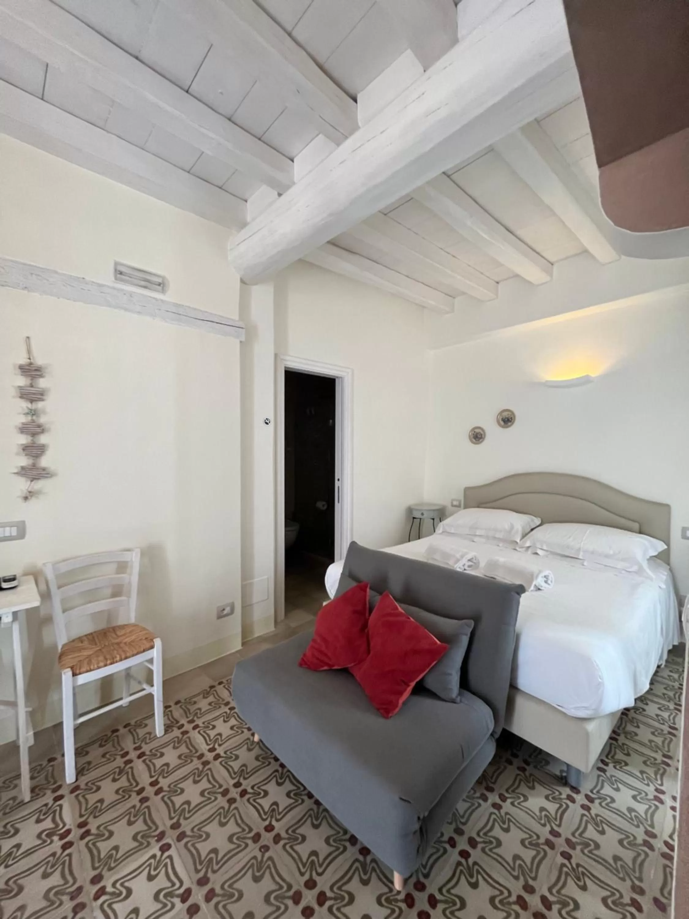 Bed in Antico Mondo Rooms & Suites
