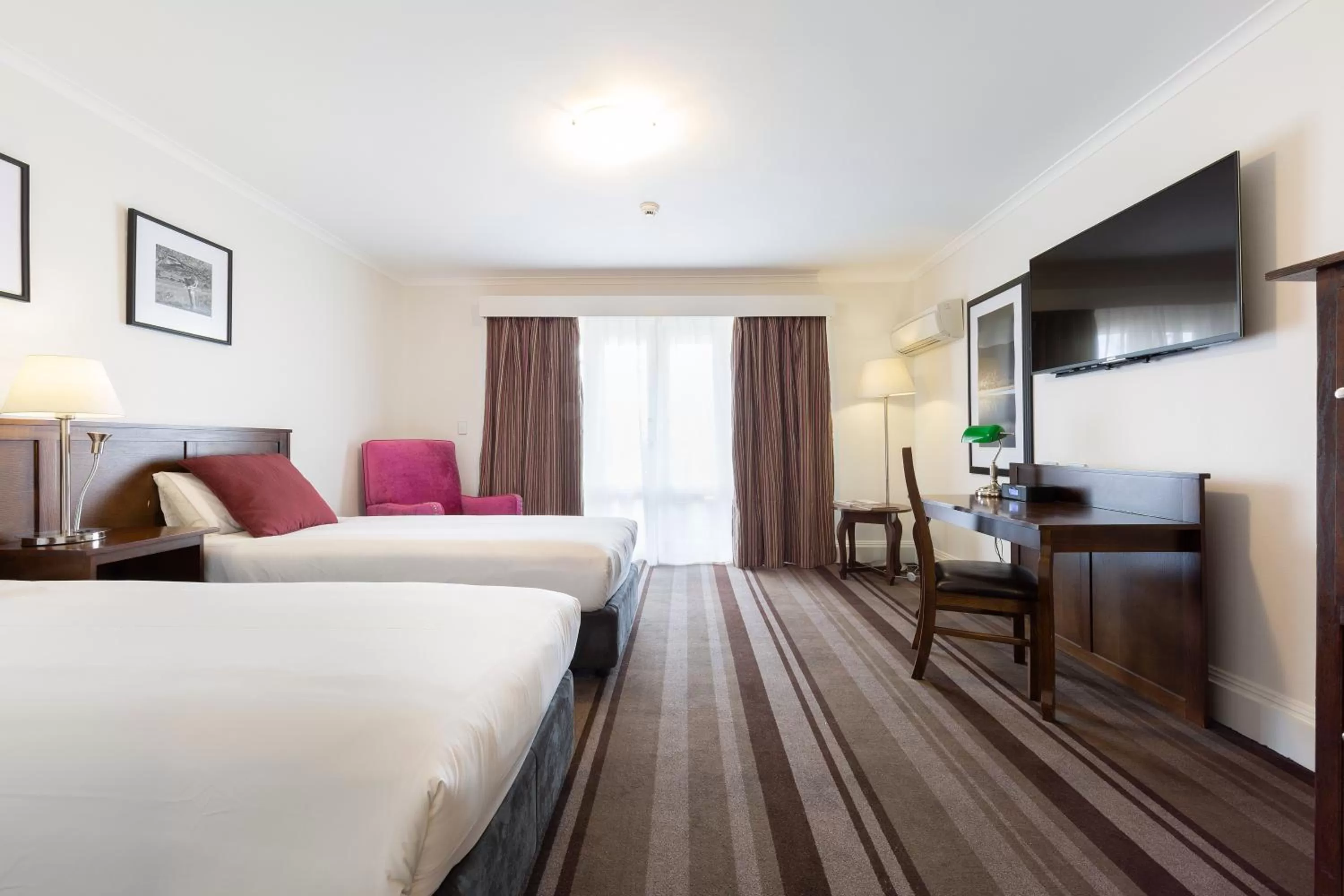 Bed in Mercure Canberra