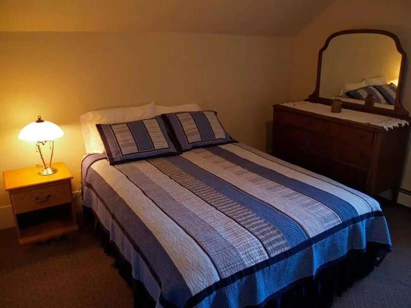 Bed in Beach Cottage Inn