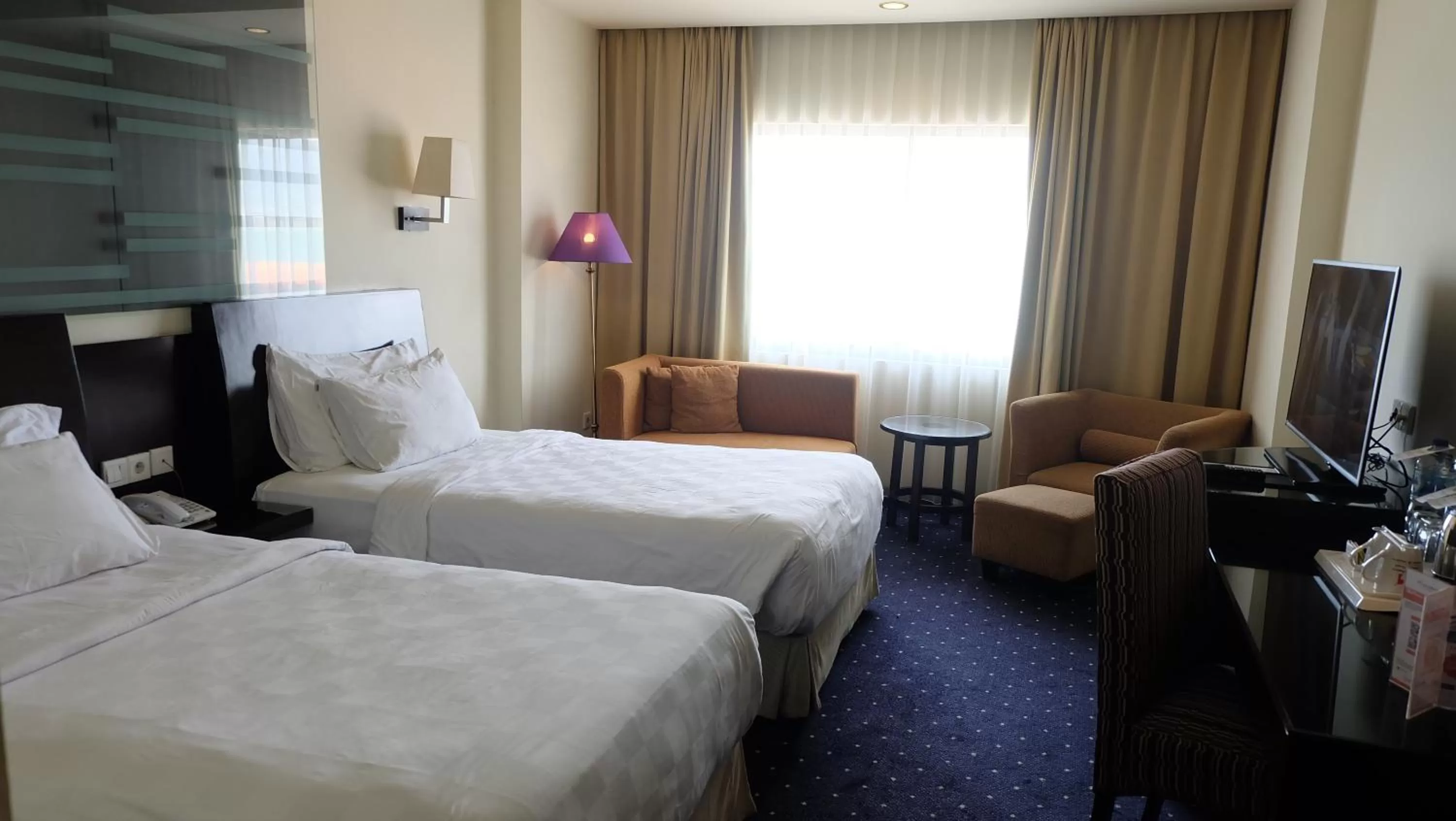 Bed in Swiss-Belhotel Silae Palu