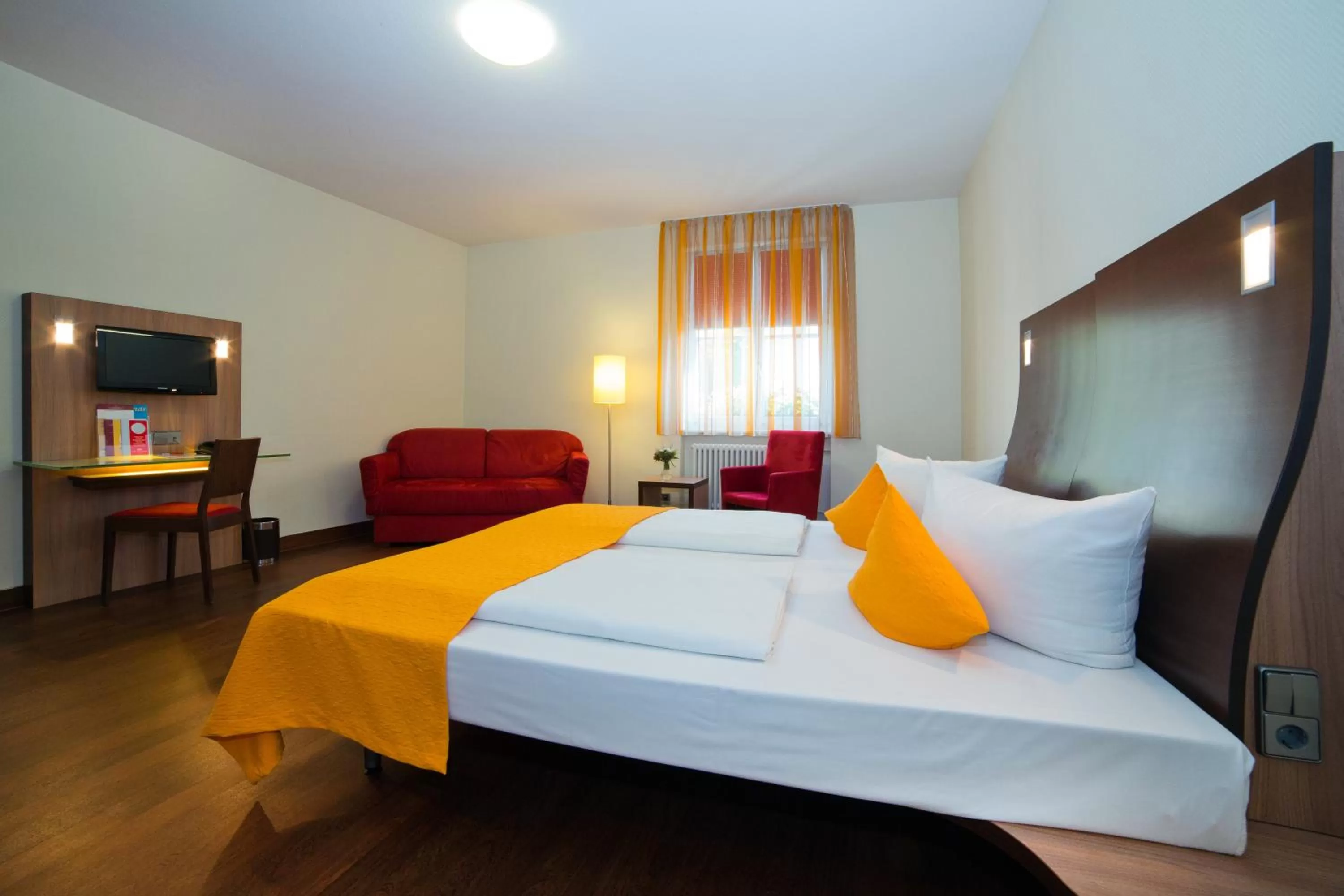 Photo of the whole room, Bed in Stadthotel Freiburg Kolping Hotels & Resorts