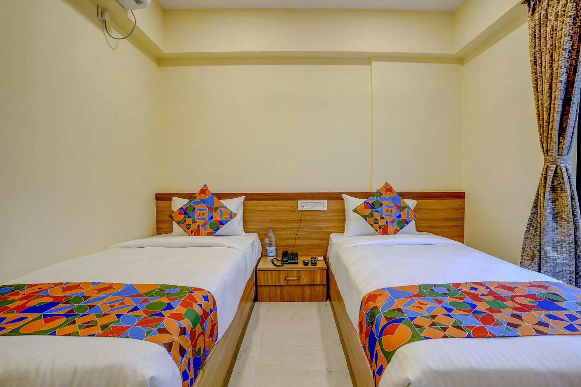 Bed in FabHotel Crystal Homes - nr Rajaram Bhiku stadium