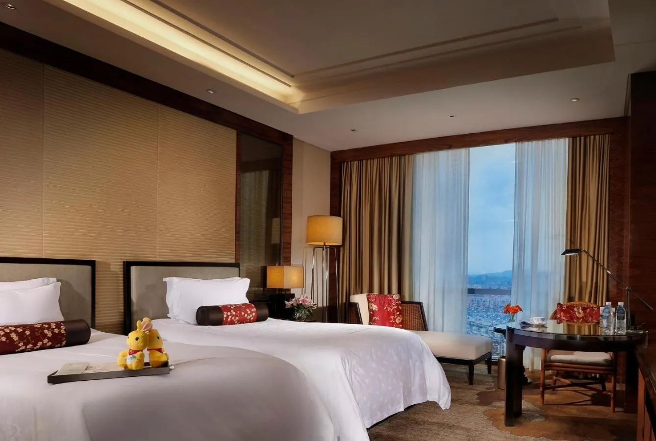 Bed in Dongguan Kande International Hotel