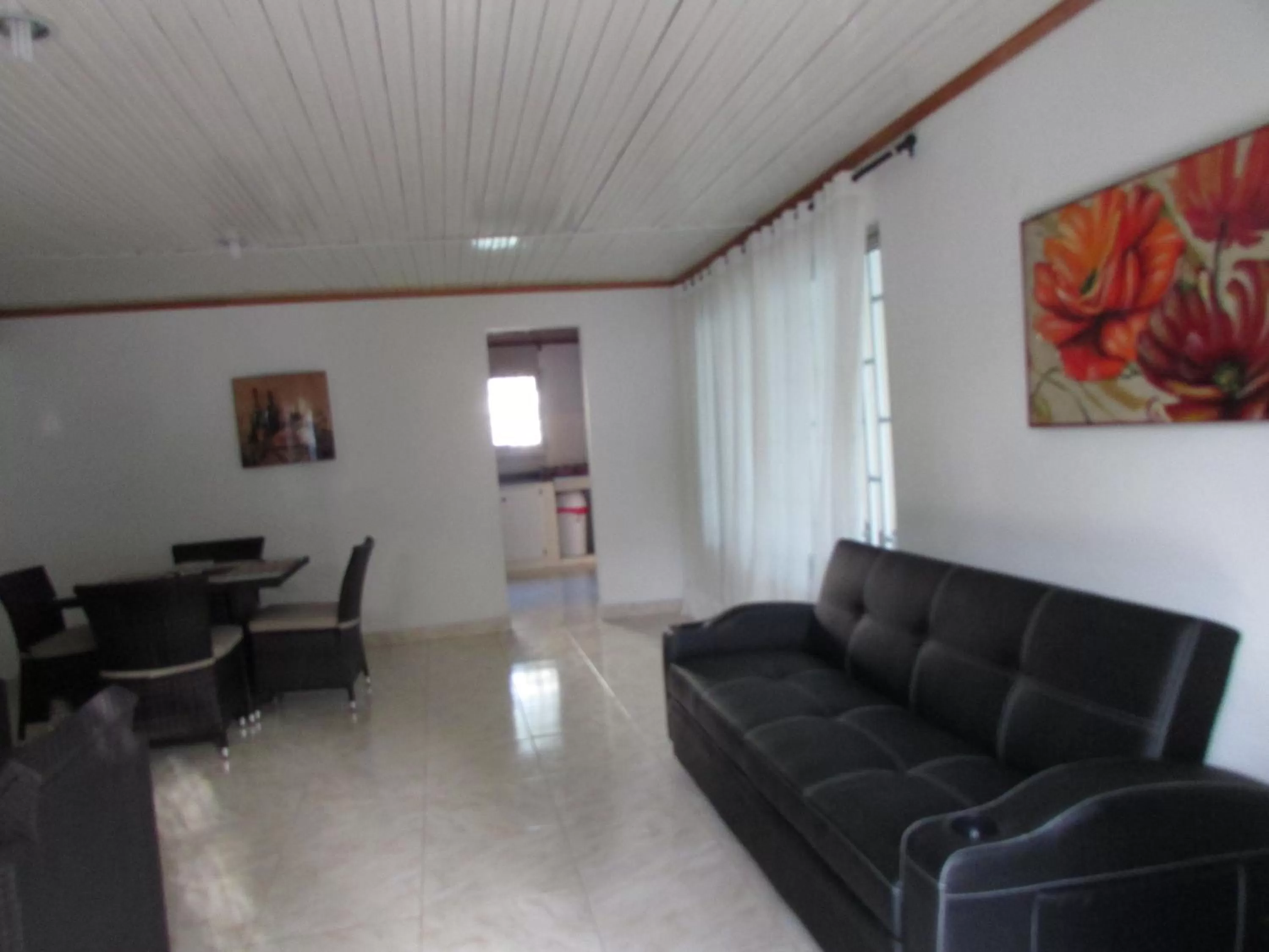 Communal lounge/ TV room in Posada Hostal Miss Marlly