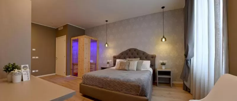 Bed in Lainez Rooms & Suites