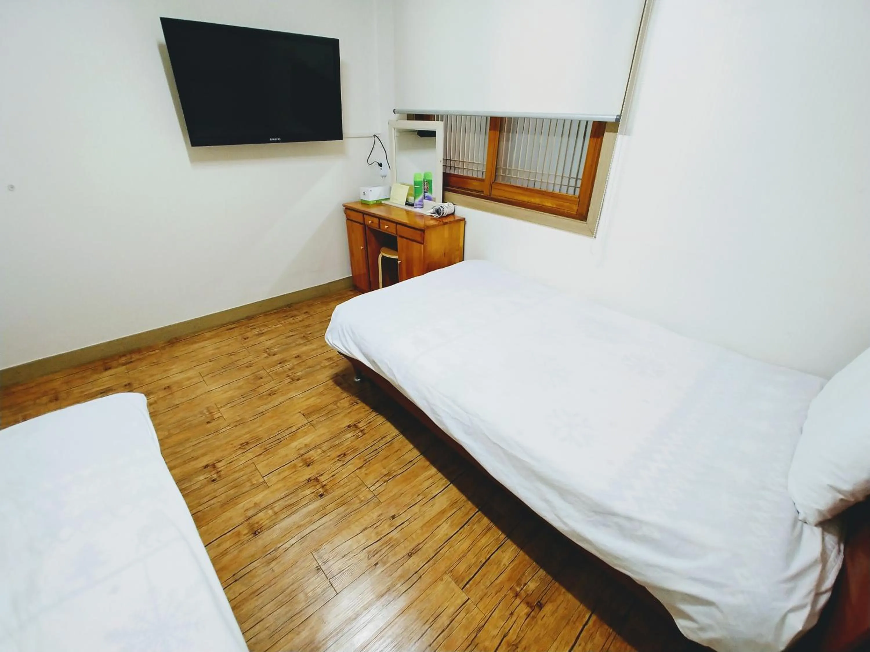 Bed in Jeju Masil Guesthouse