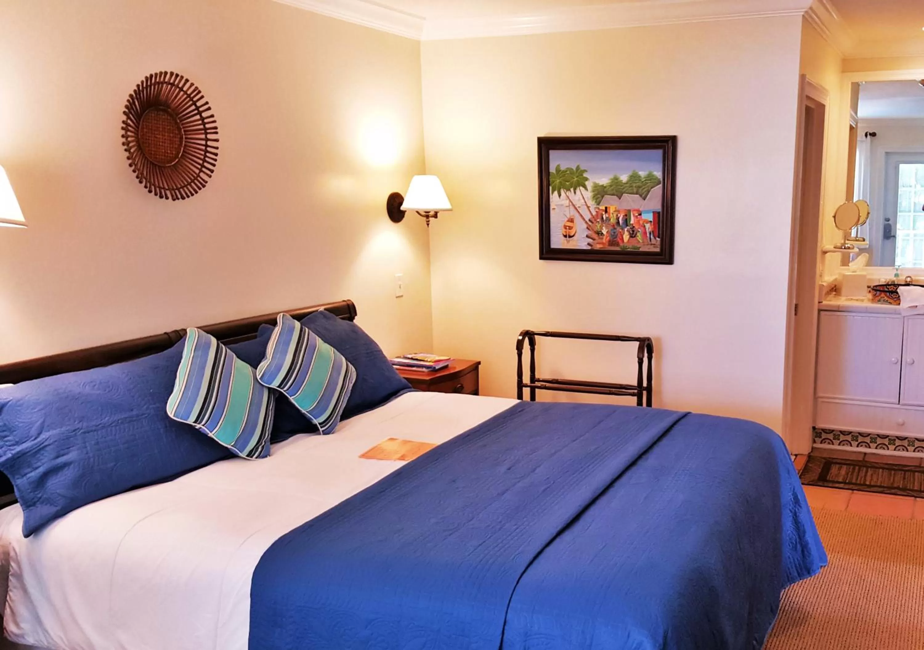 Photo of the whole room, Bed in The Caribbean Court Boutique Hotel