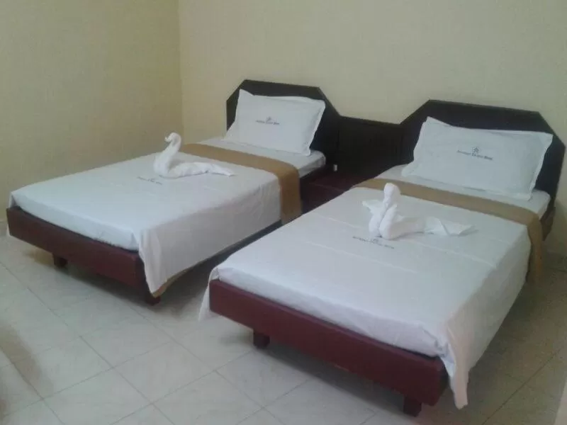 Bed in Anandan Tourist Home