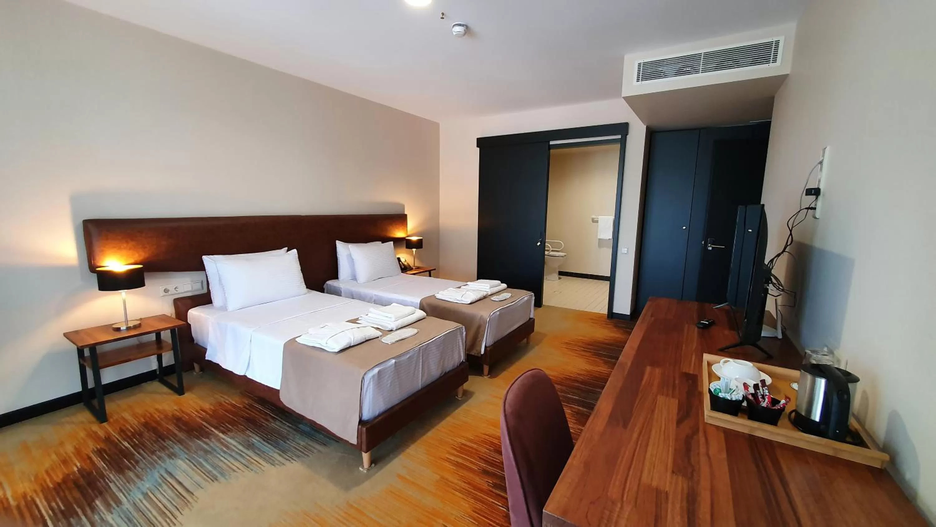 Bed in CAROUSEL HOTEL