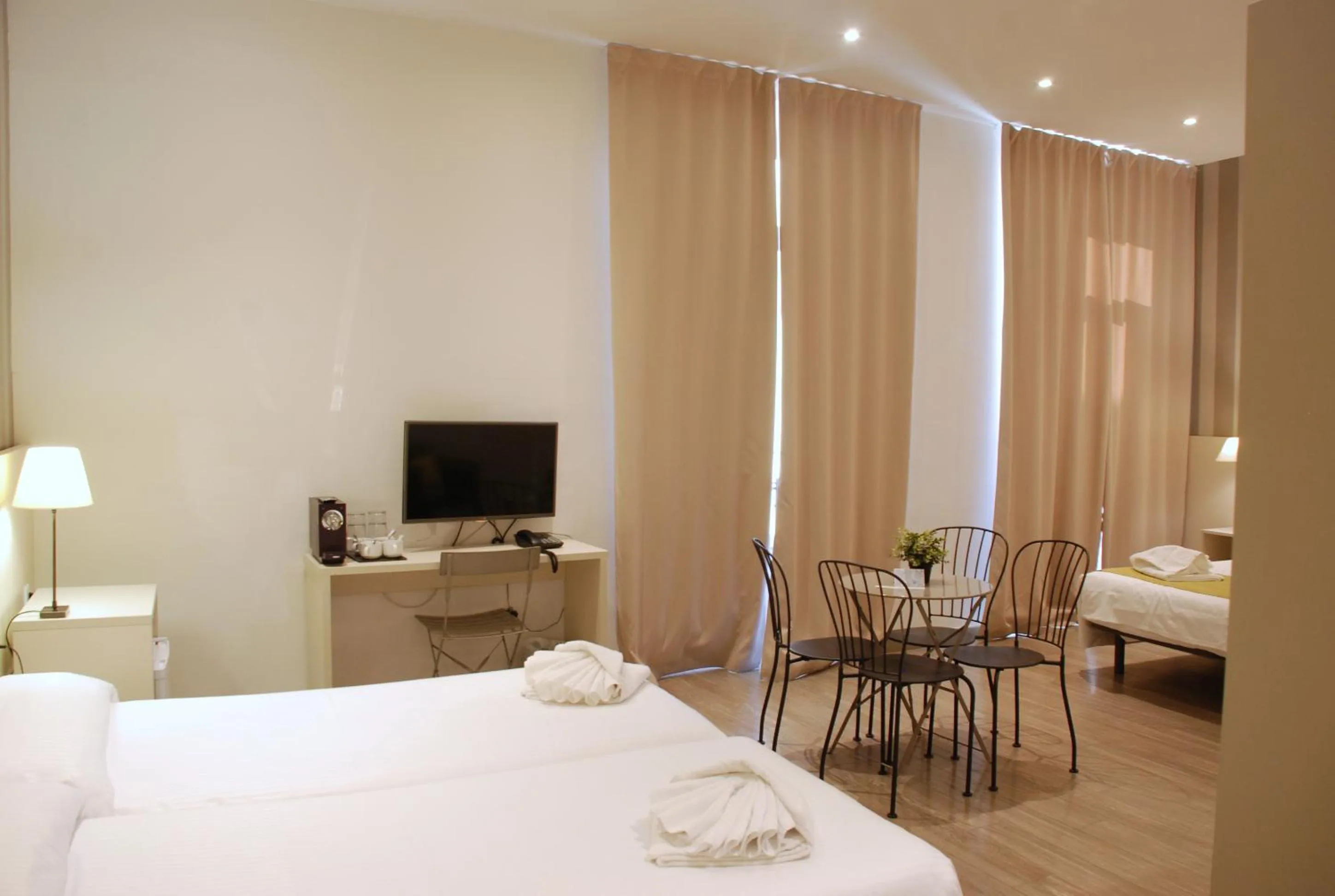 Bed in Hotel San Lorenzo Boutique Plaza