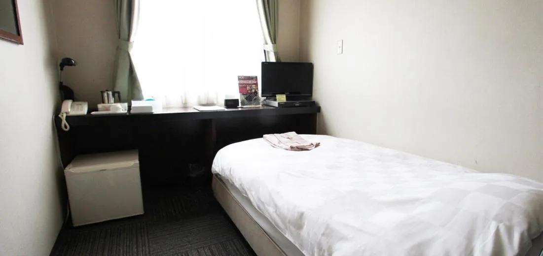 Bed in Takamatsu City Hotel