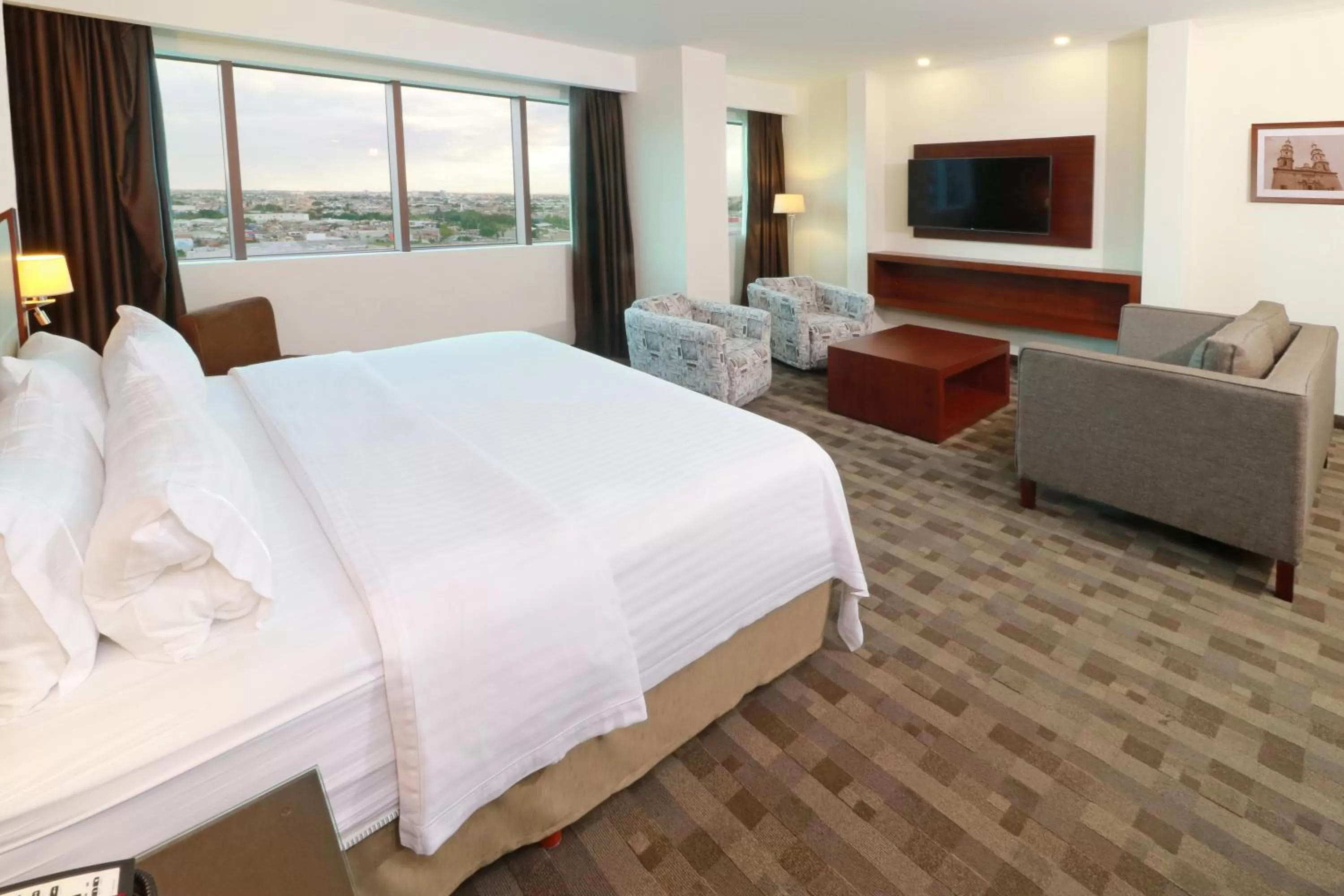 Photo of the whole room, Bed in Holiday Inn & Suites Plaza Mayor by IHG